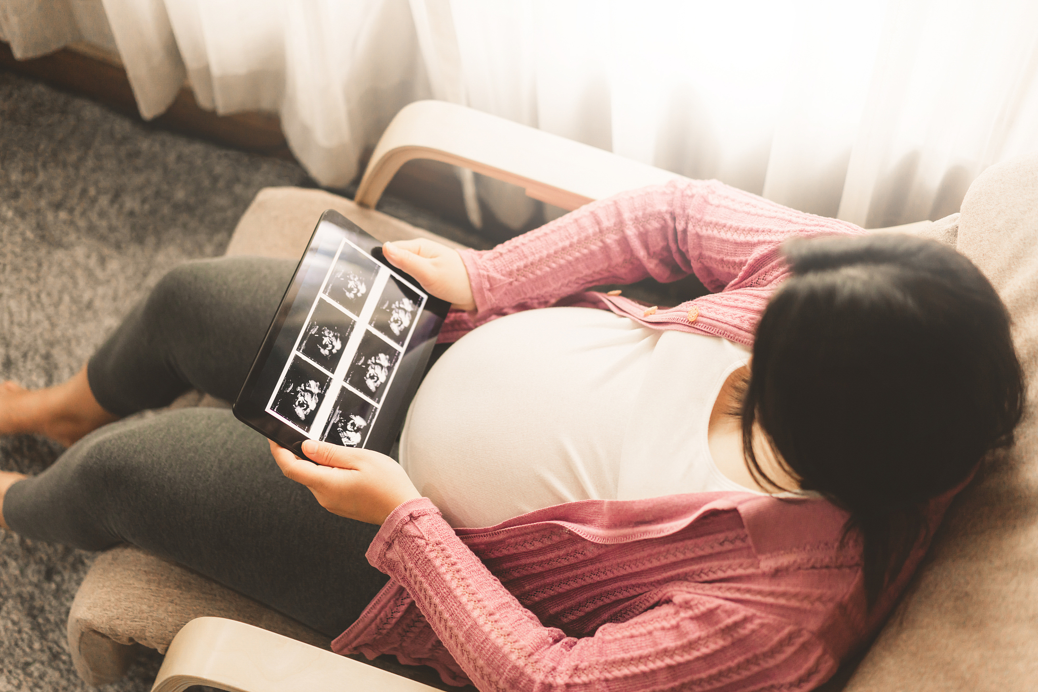 happy pregnant woman and expecting baby at home.