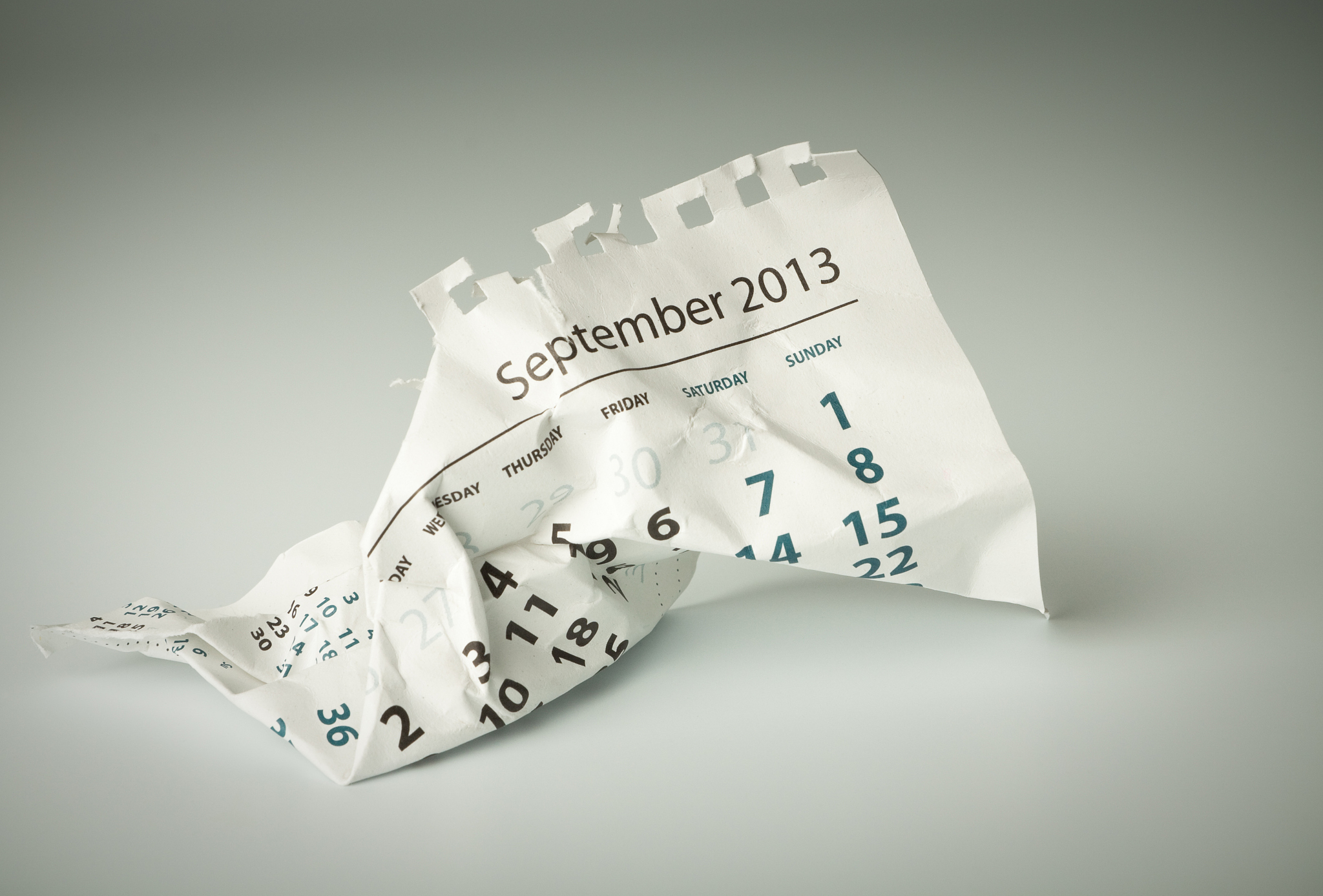 september. crumpled calendar sheet