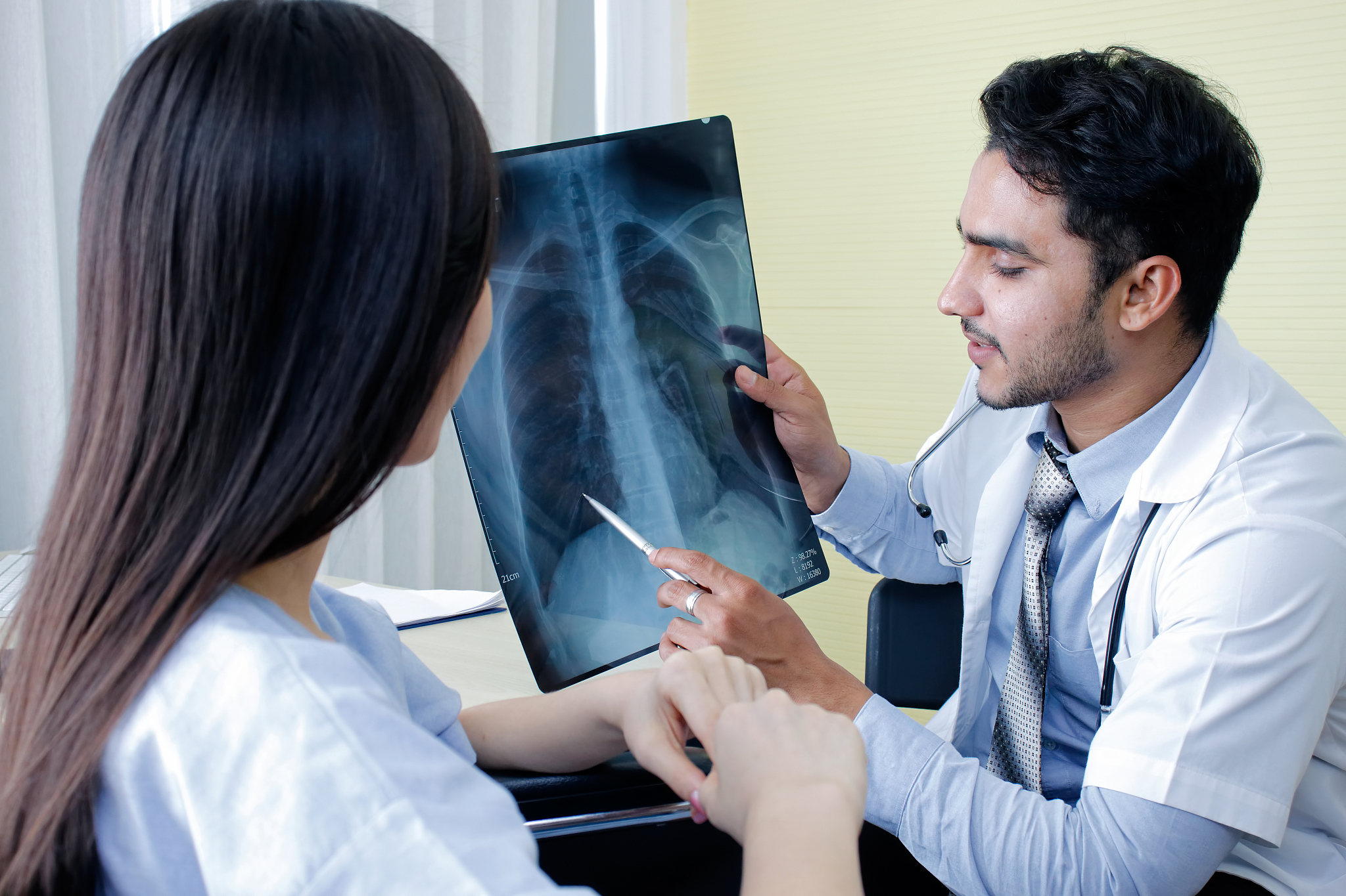 professional doctor and radiologist giving a consultation to her