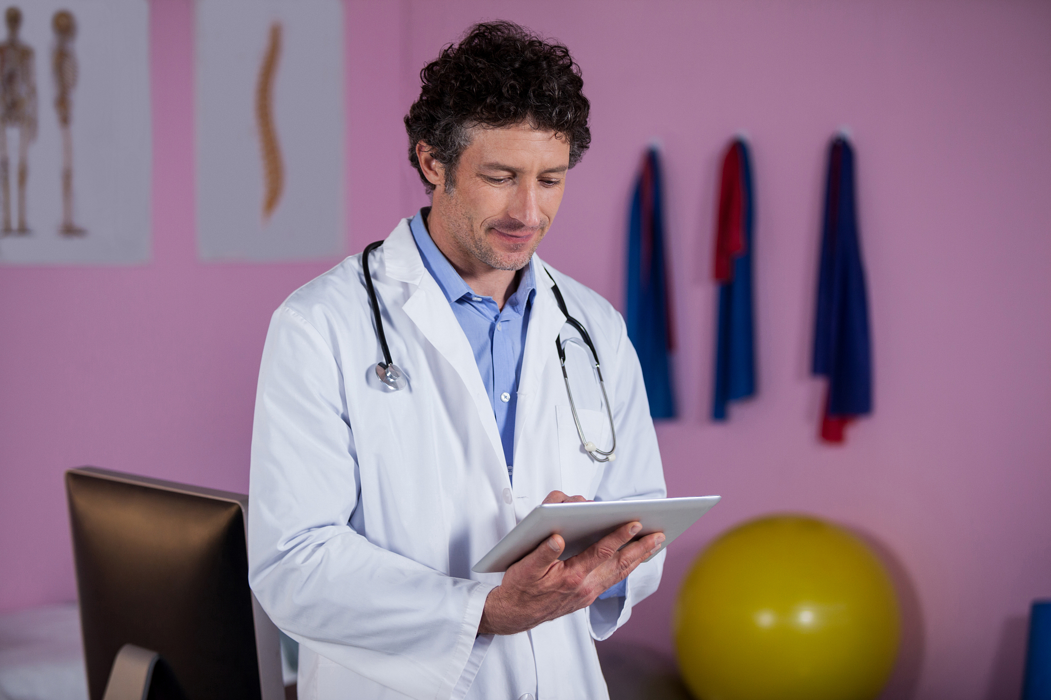 physiotherapist using digital tablet
