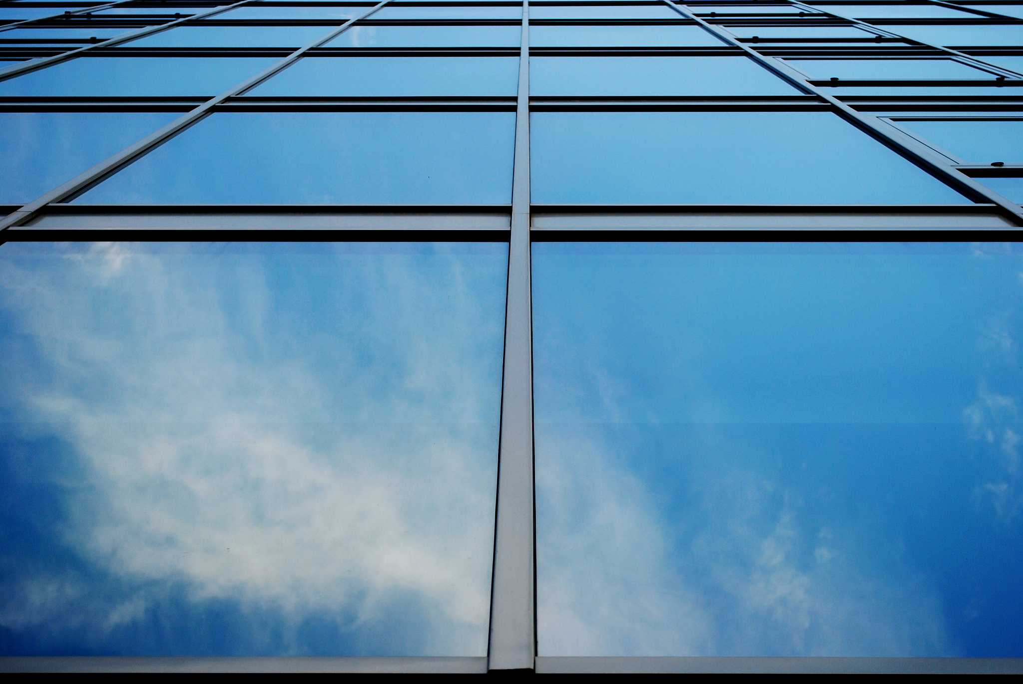 sky reflecting in skyscraper glass