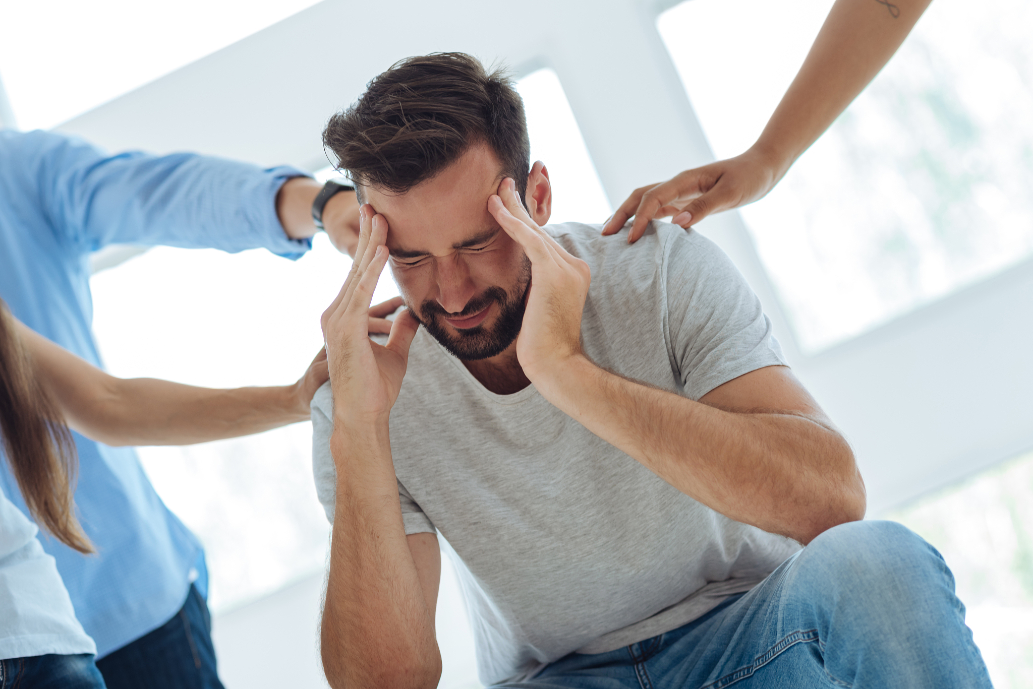 cheerless moody man closing his eyes