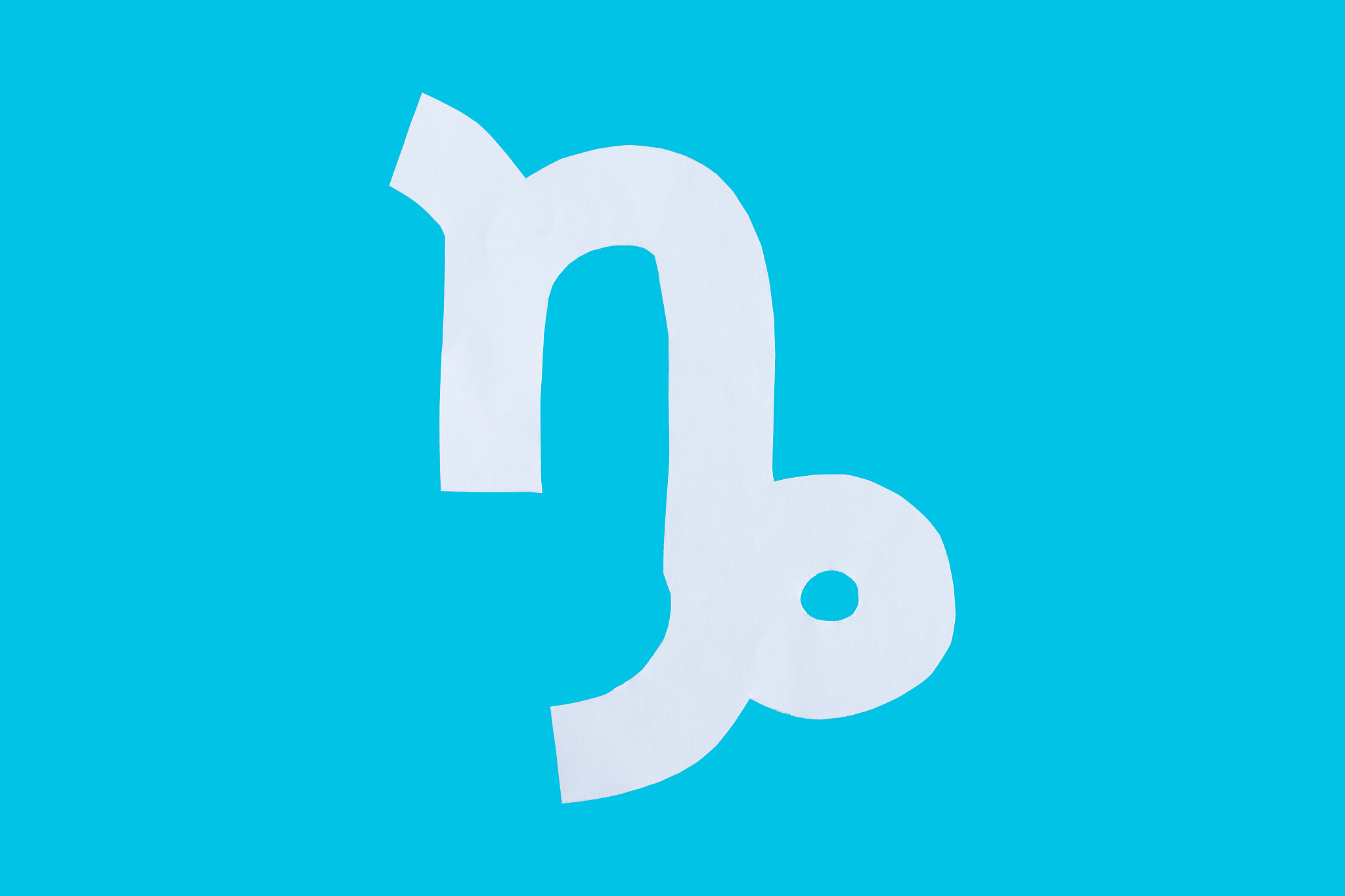 paper cut horoscope sign isolated on a blue background
