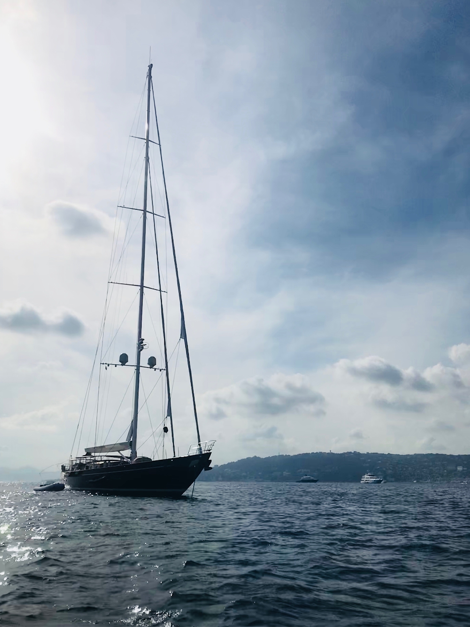 sailboat sailing on sea against sky