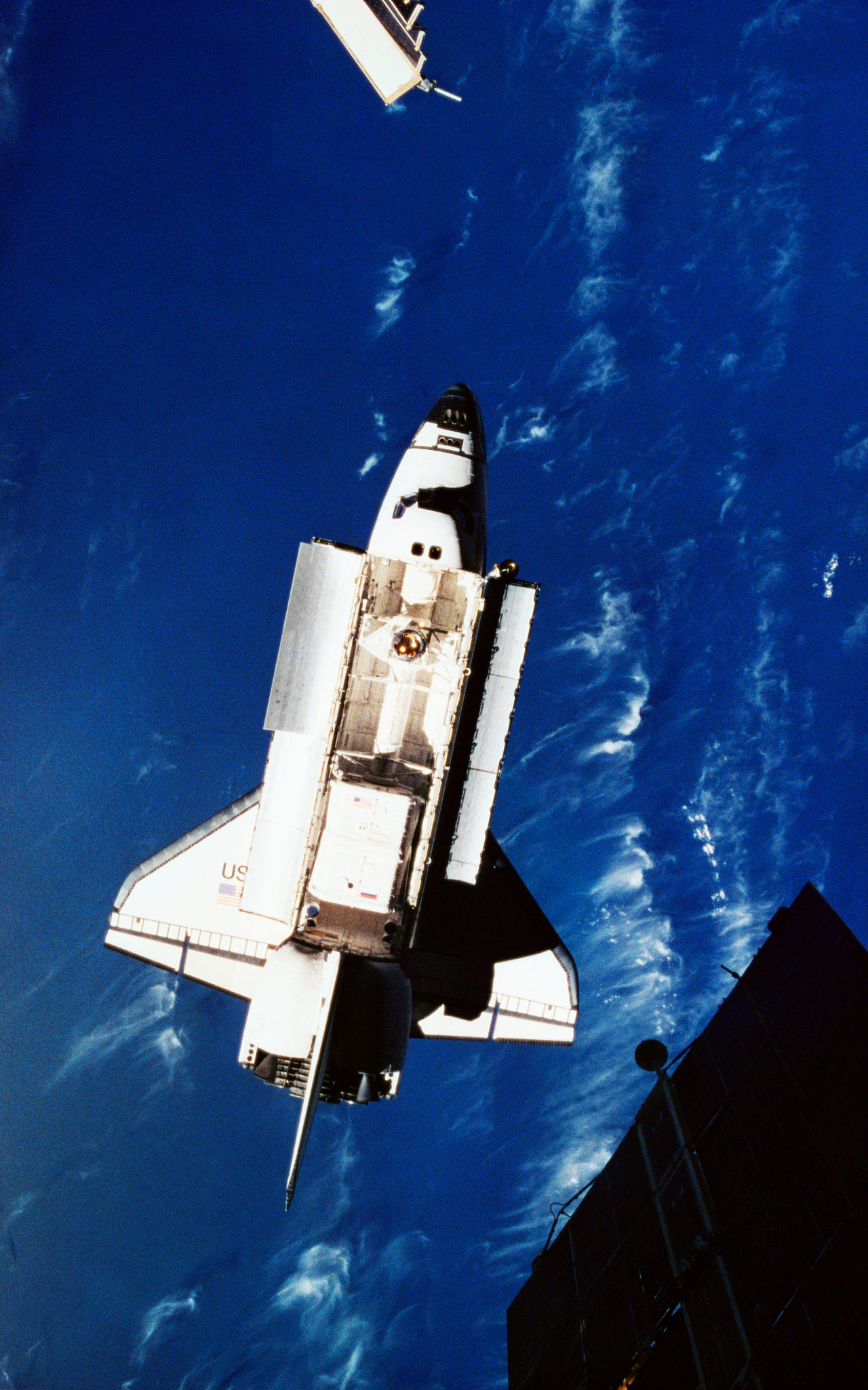 elevated view of the space shuttle with its cargo bay open above