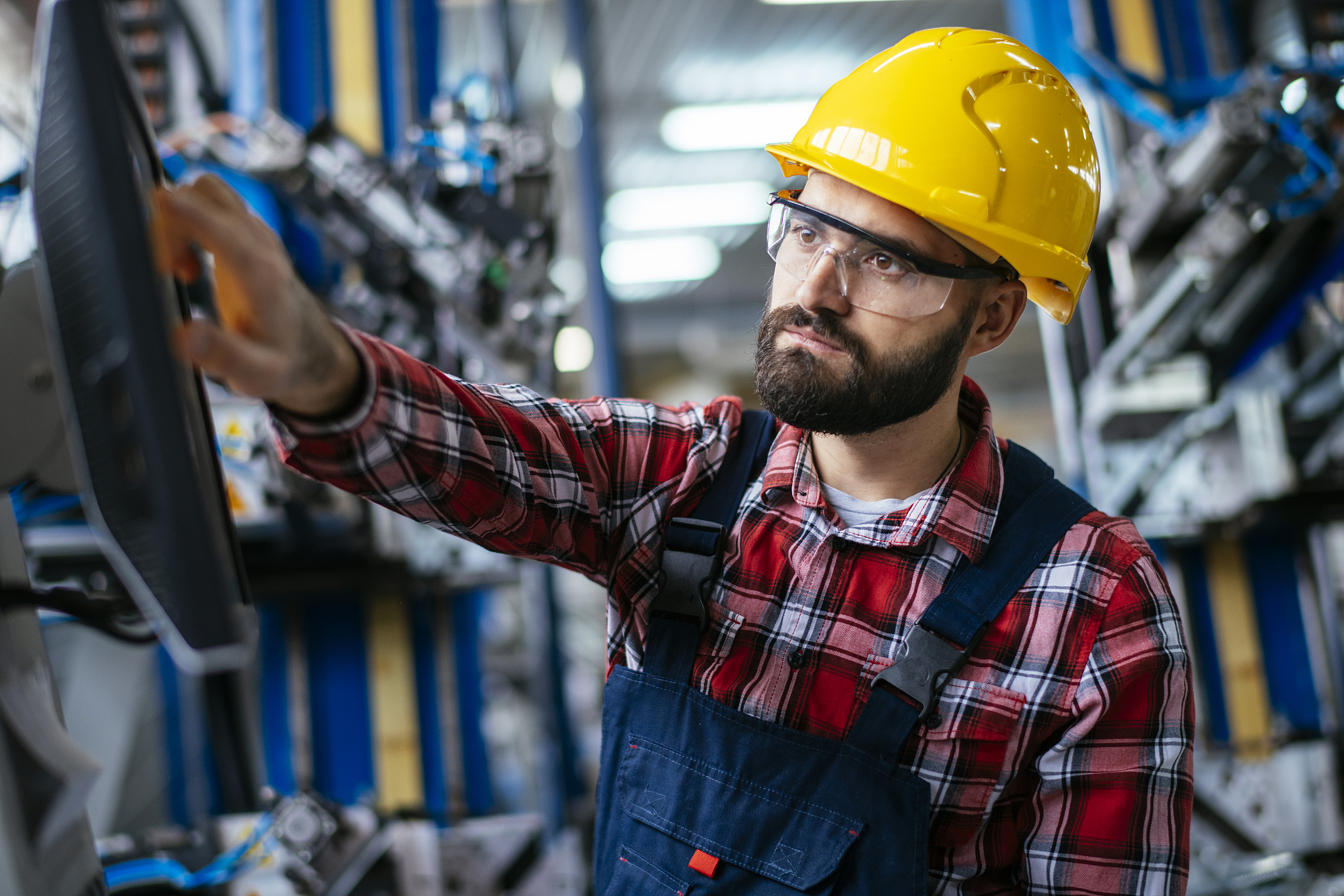 worker in factory on machine