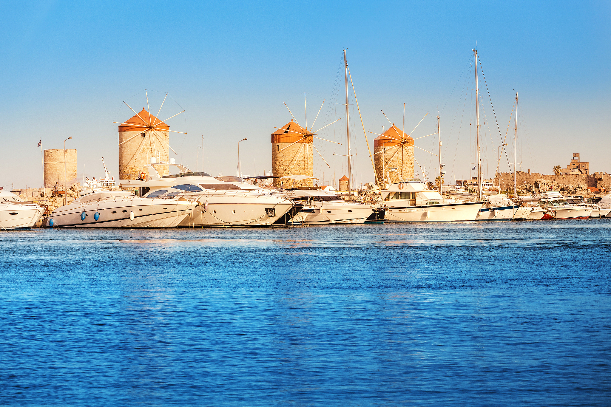 tourist and history landmarks - windmills in the mandraki sea po