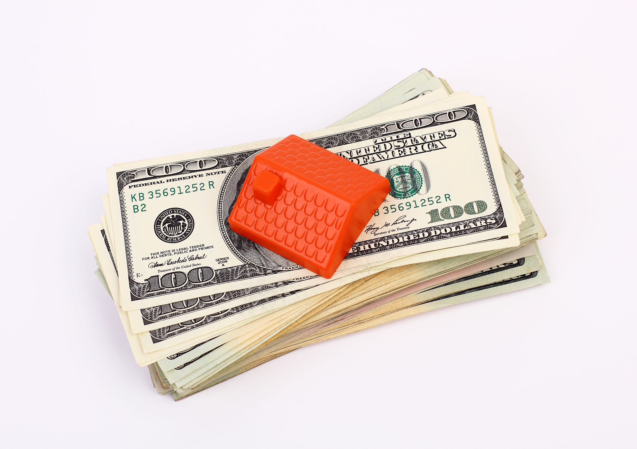 roof on the stack of dollars