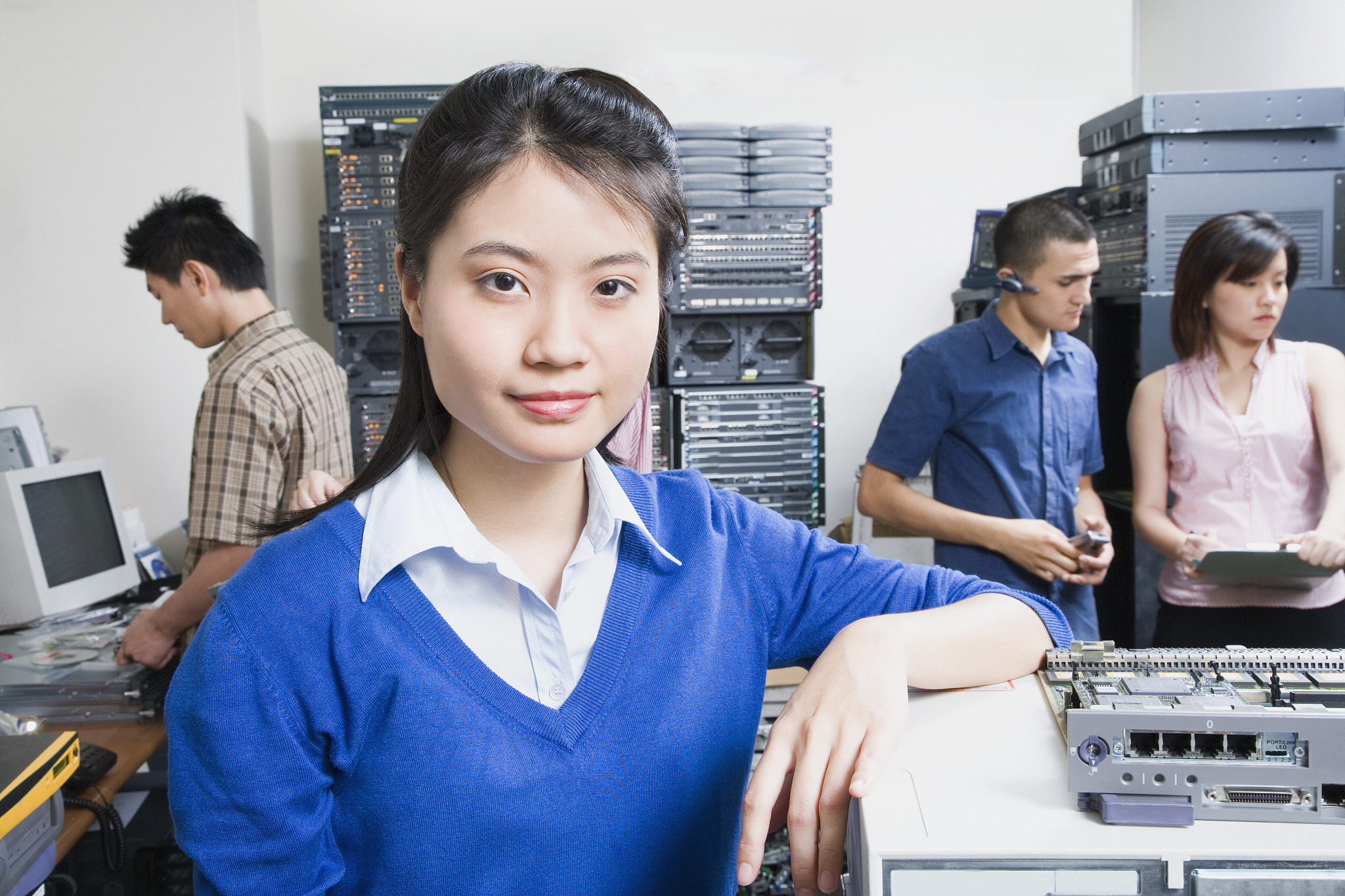 woman with coworkers in server room