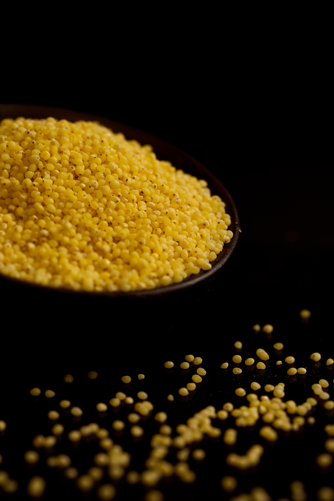 proso millet in dark bowl