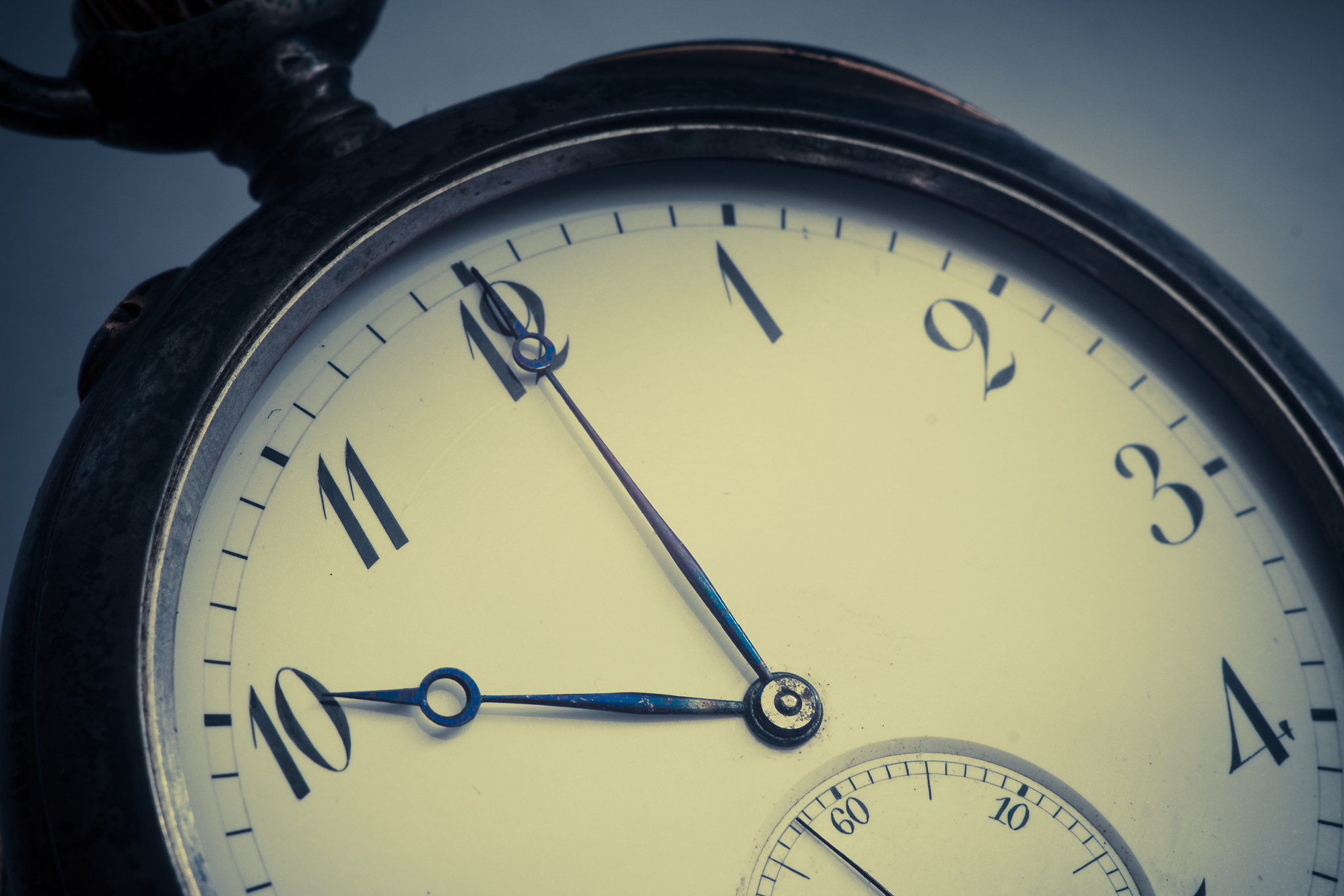 close-up view of a silver pocket watch.