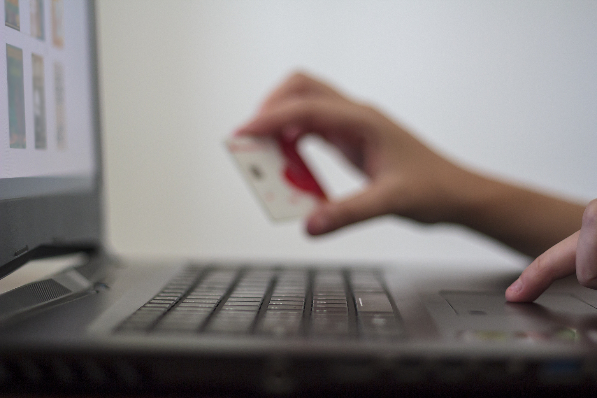 woman using laptop computer and credit card for online shopping