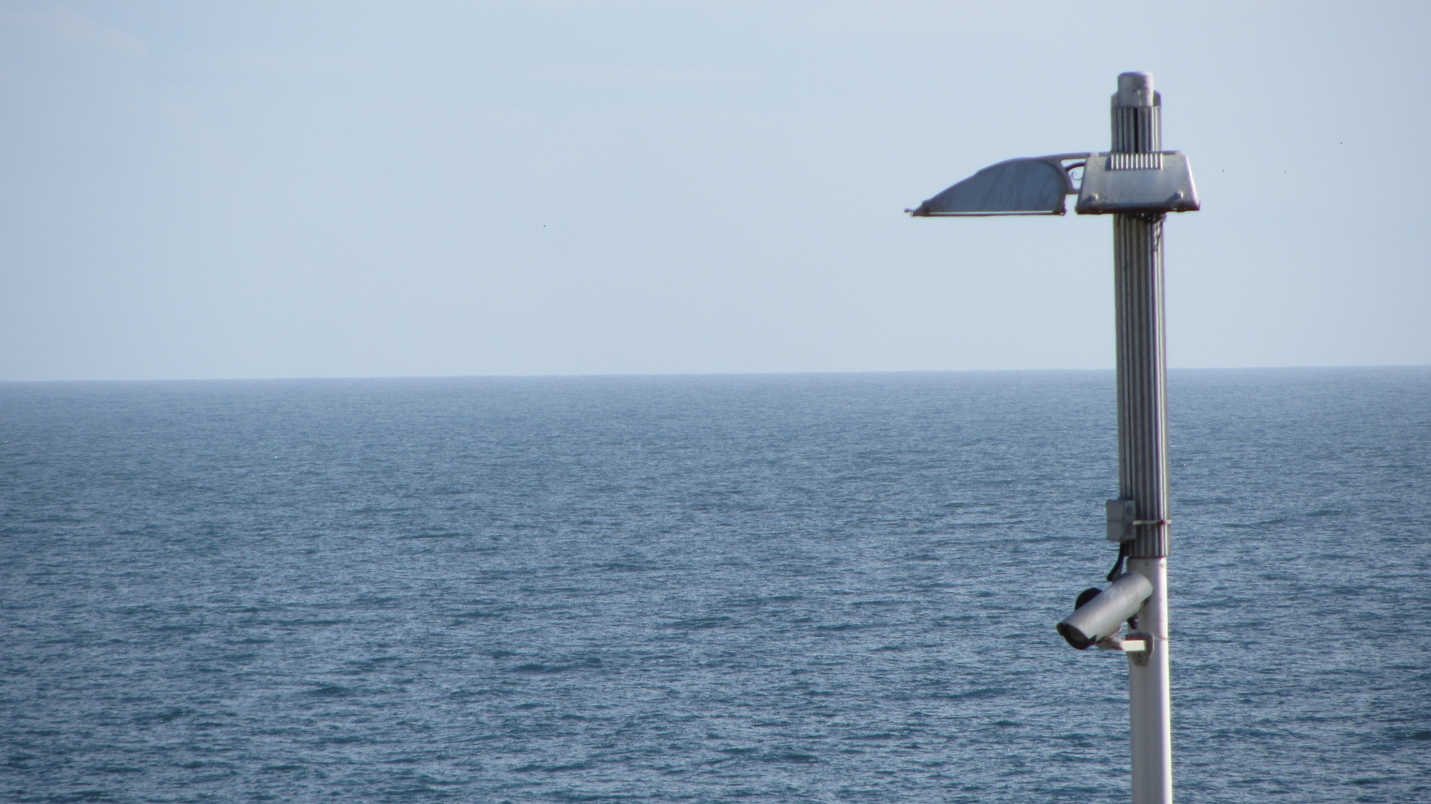 street light against sea