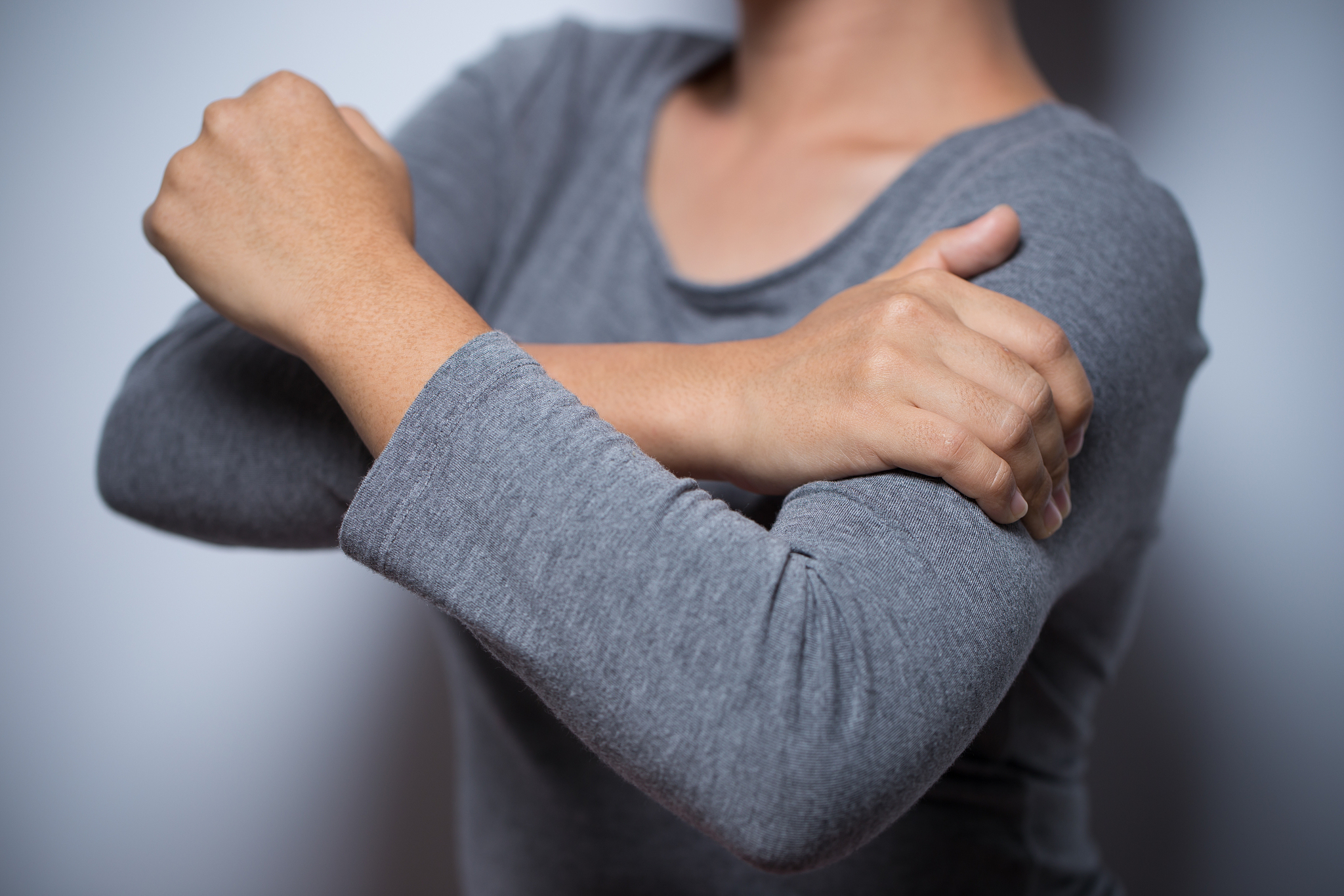 woman has arm pain