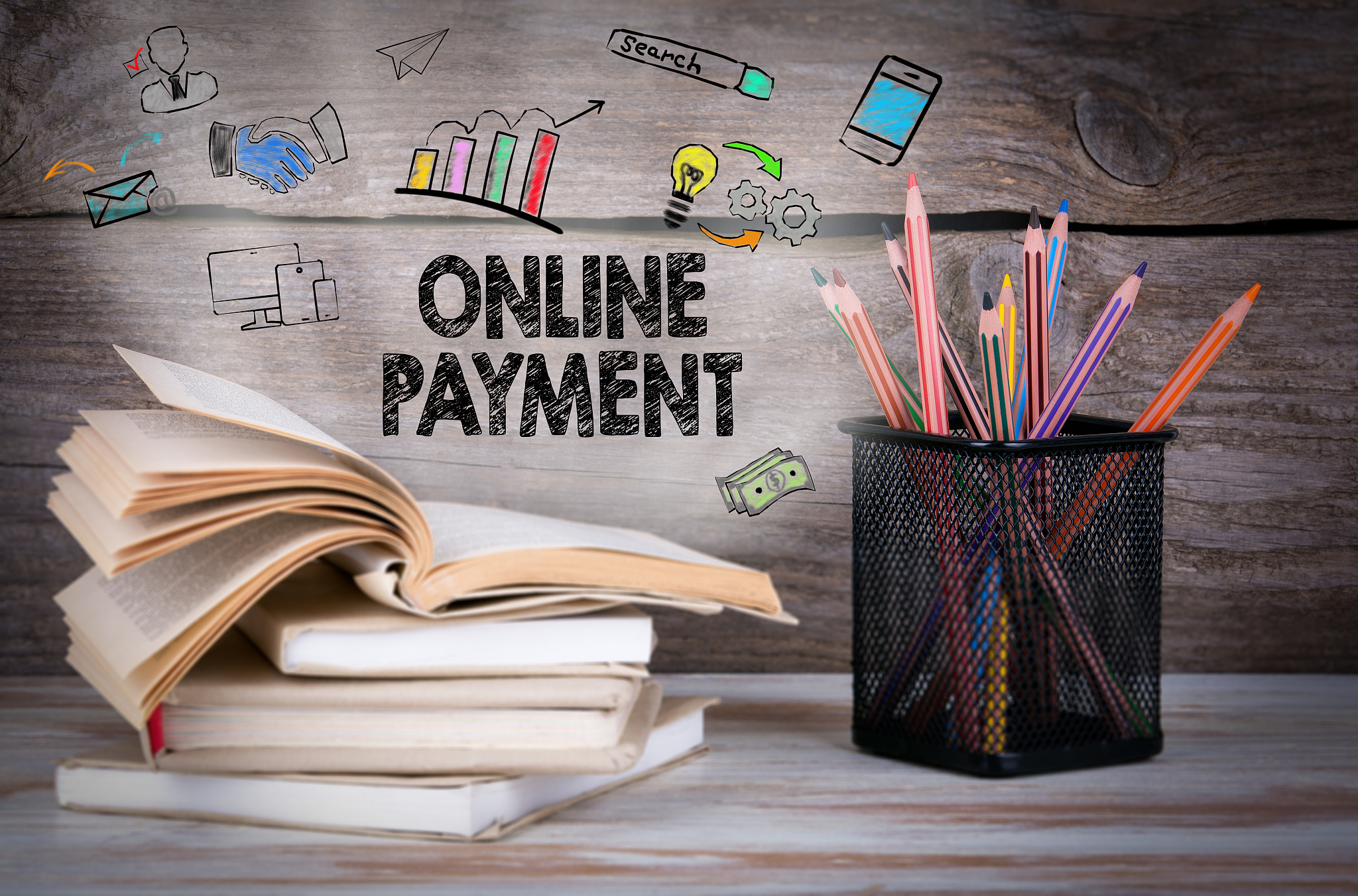 online payment, business concept. stack of books and pencils on