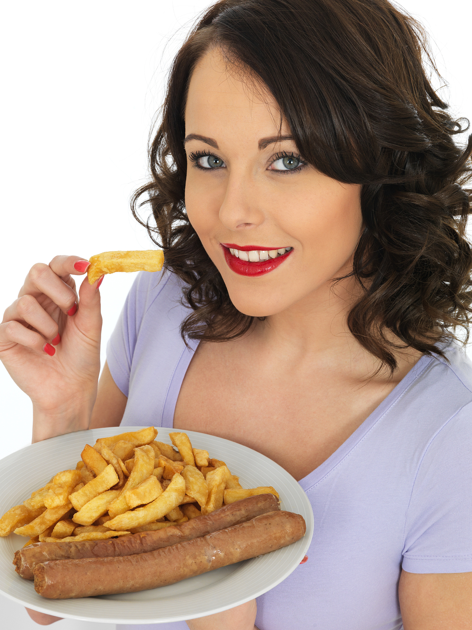 young woman eating jumbo sausages and chips