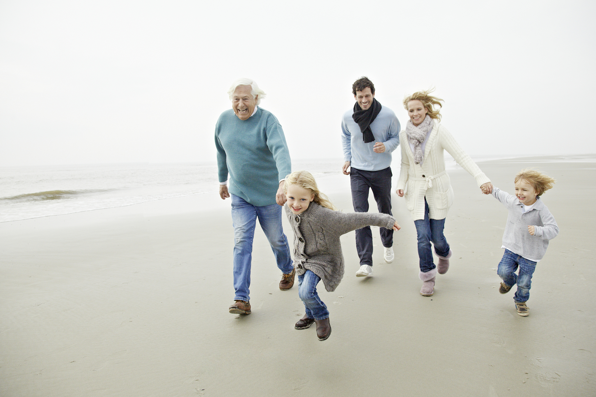 family walking on a beach