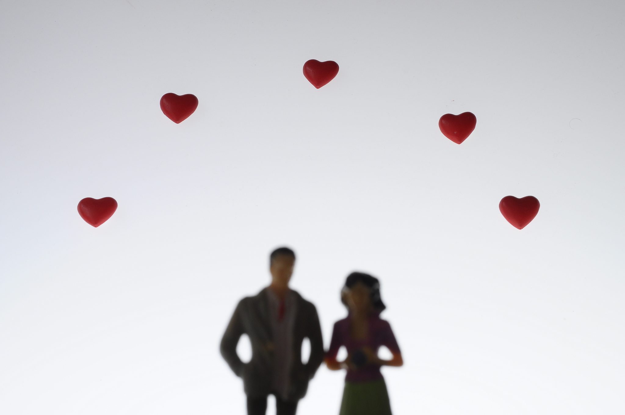 couple man, woman and red hearts