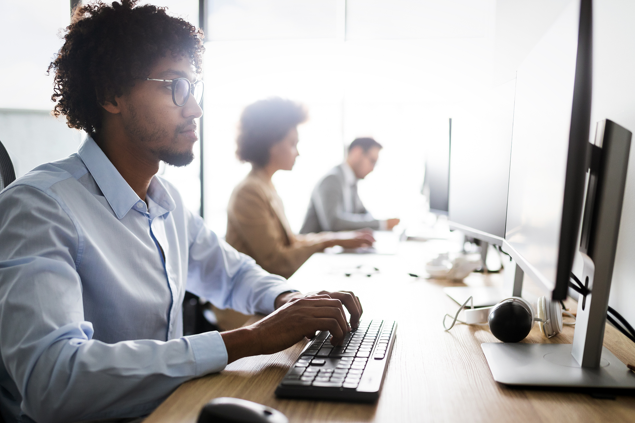 programmers cooperating at it company developing apps