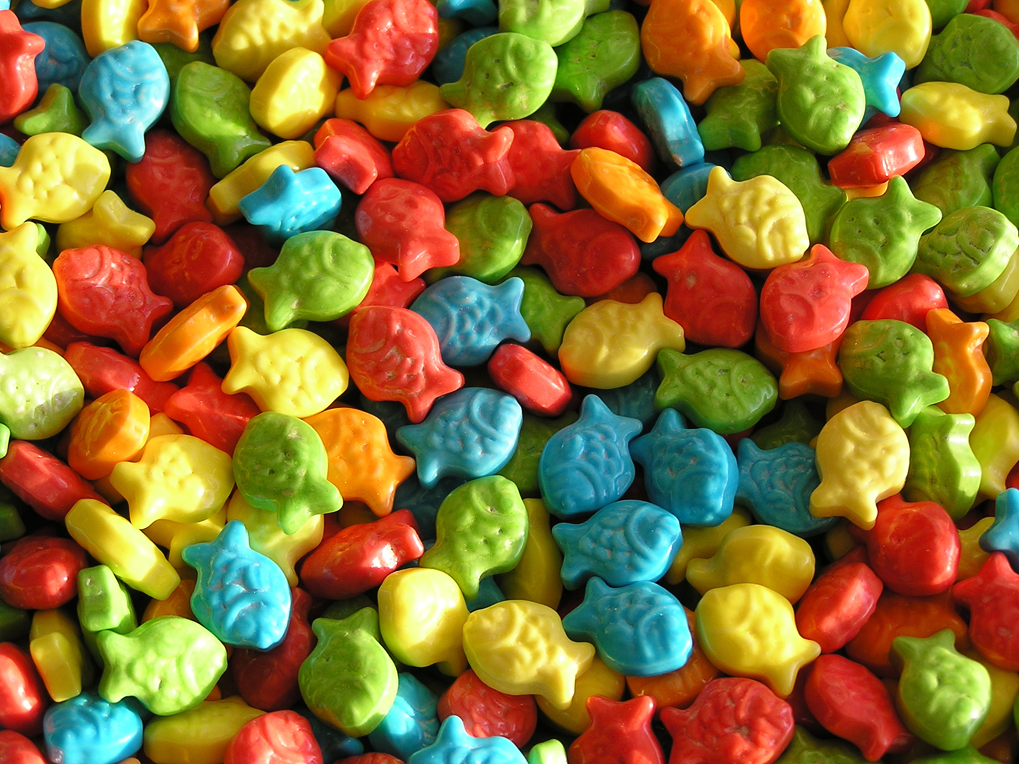 做糖块时一个滚轴用来使粘性很大的糖和色素能均匀的机器是什么