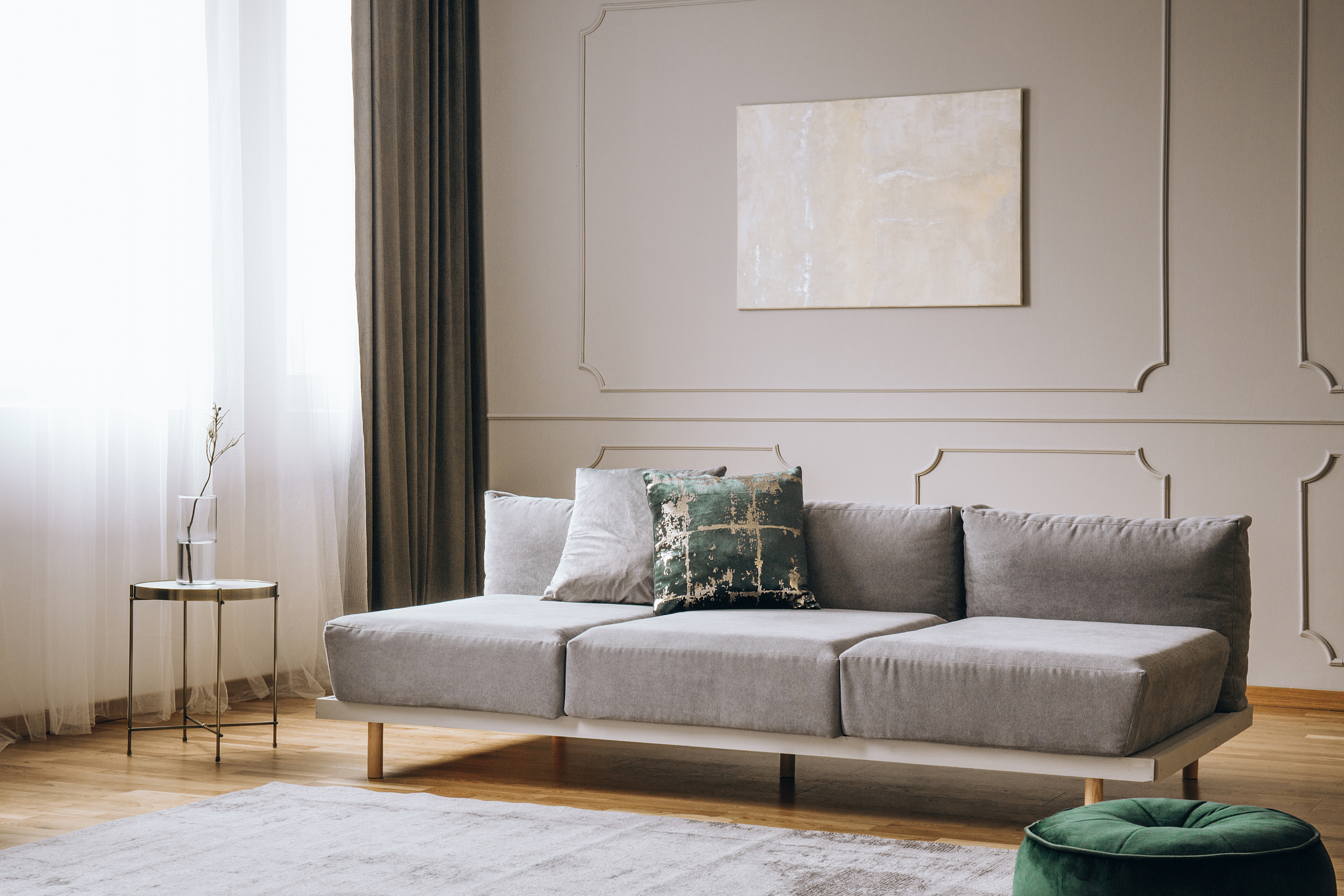elegant living room interior with comfortable sofa, real photo