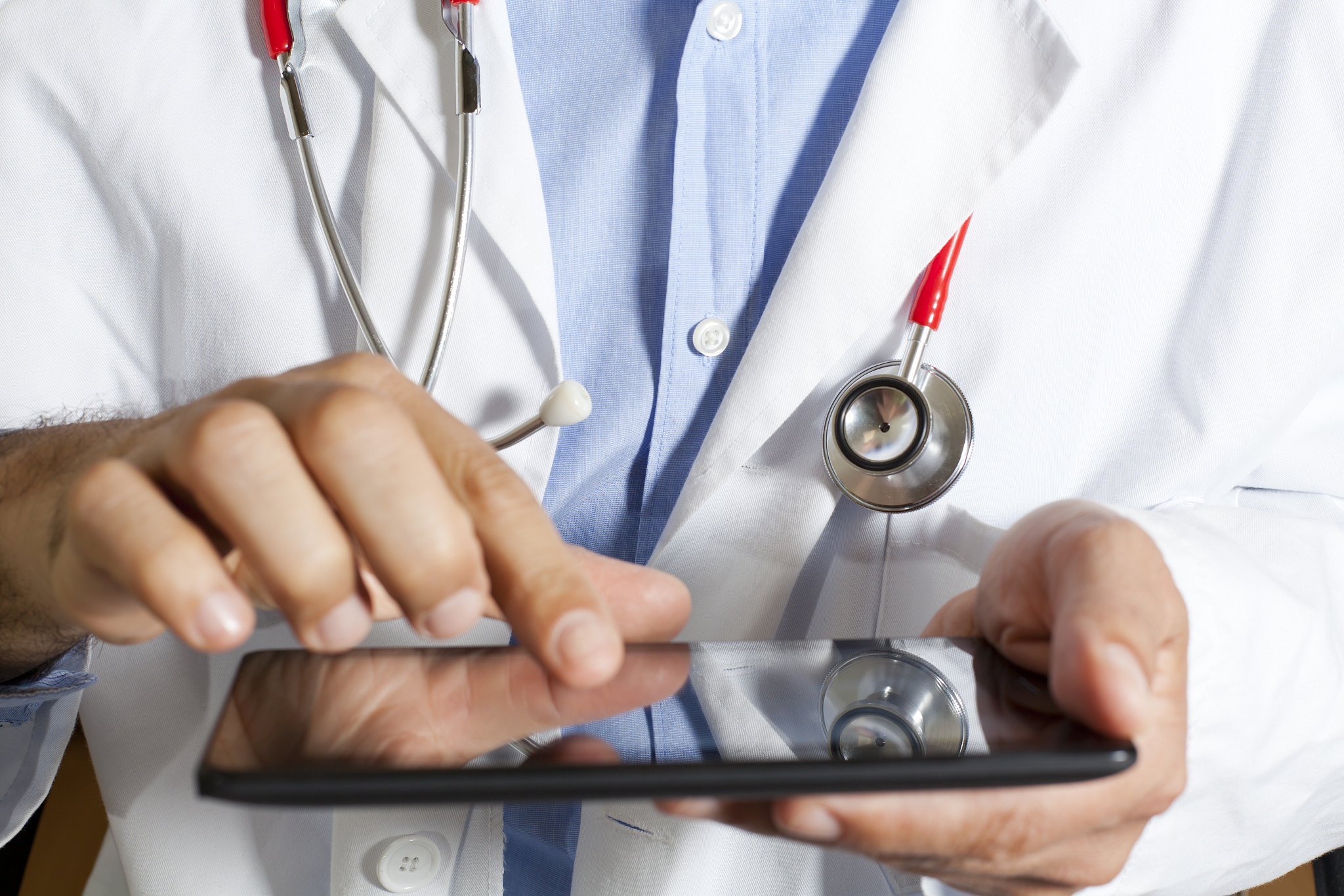 doctor with tablet