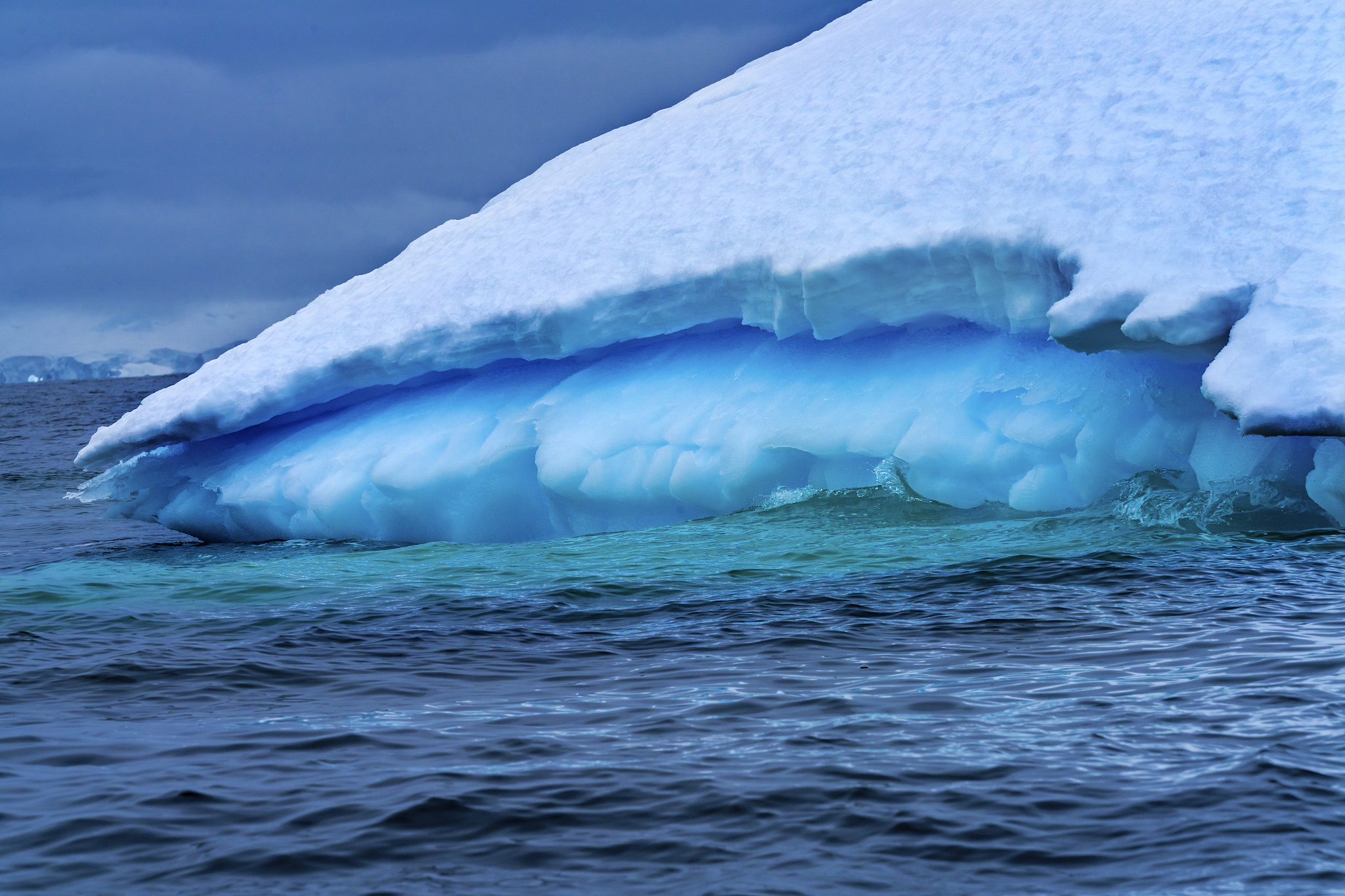 floating blue green iceberg closeup water antarctica