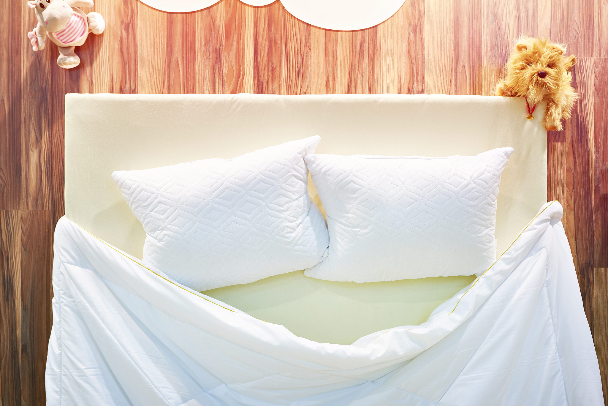 pillows and blanket on bed