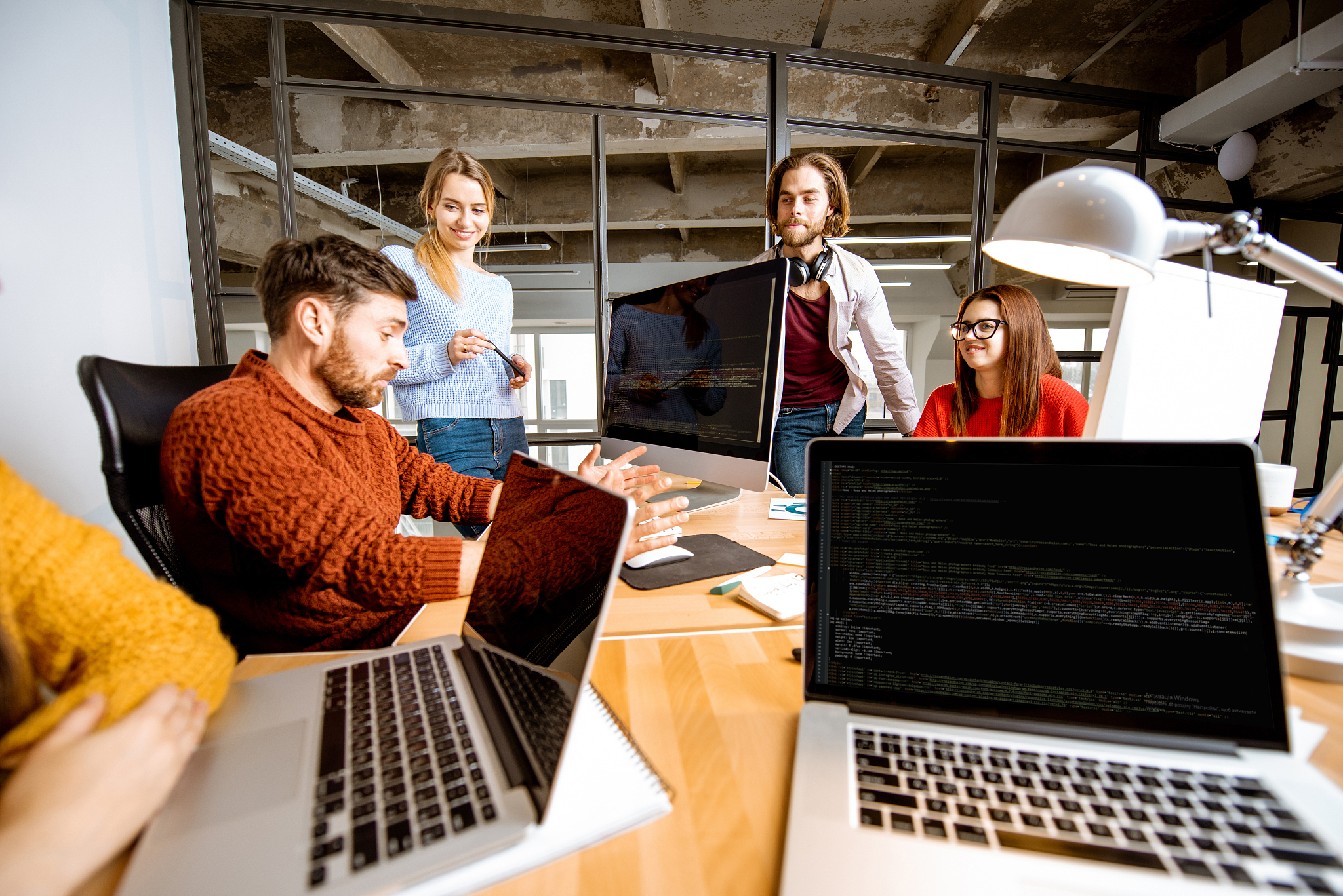 people working together on the computers in the office