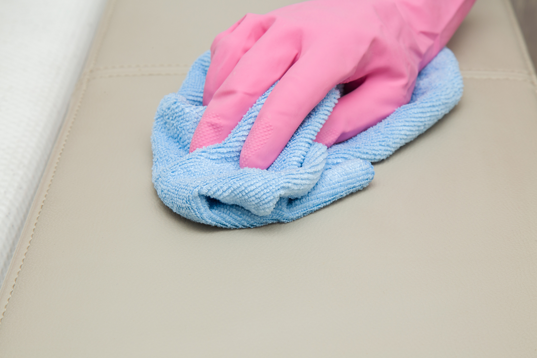 leather area cleaning with rag. upholstered furniture. early spr