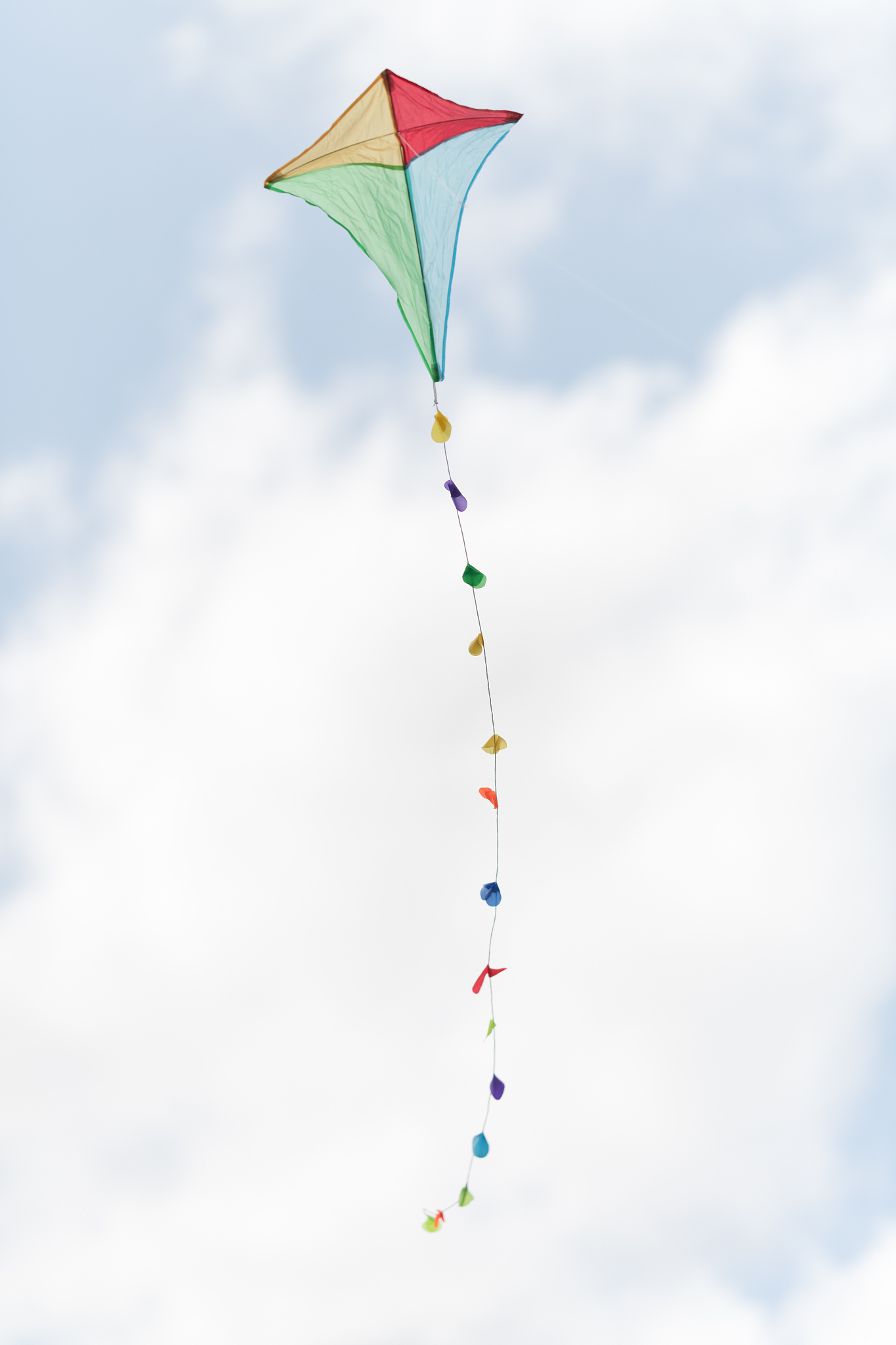 colorful kite in a cloudy sky