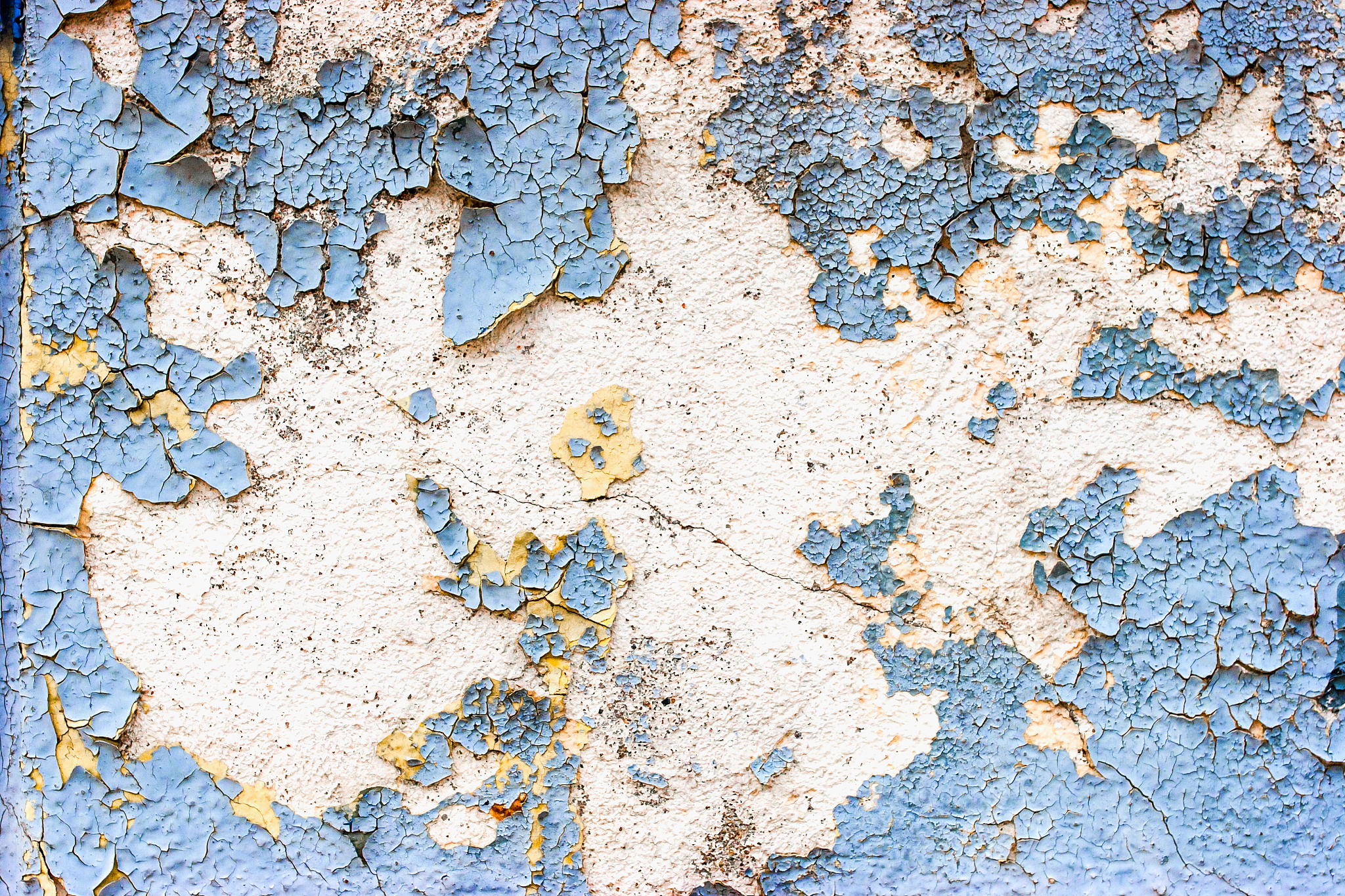 old  stone wall  with cracked blue  color paint background