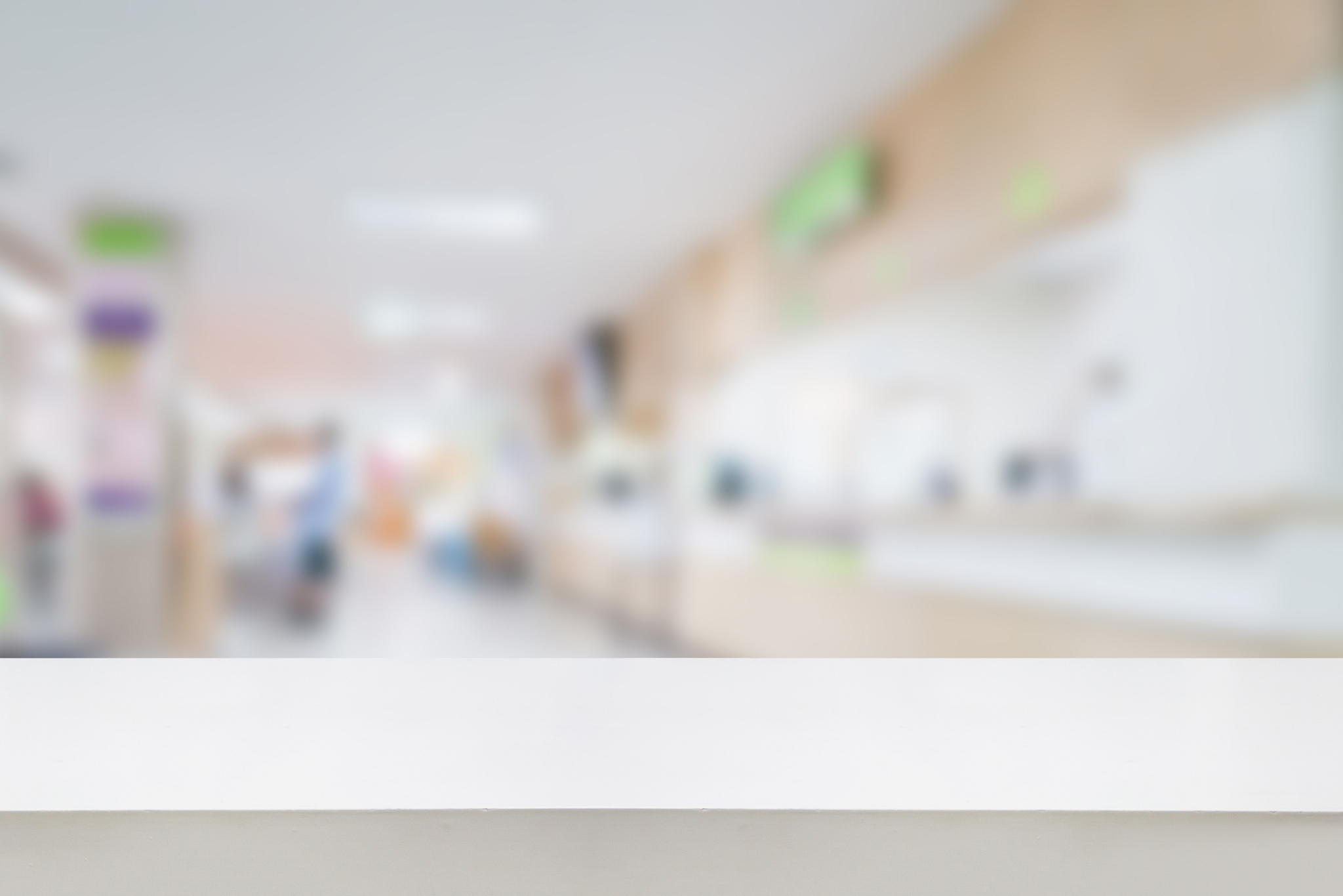empty white desk with blur hospital background