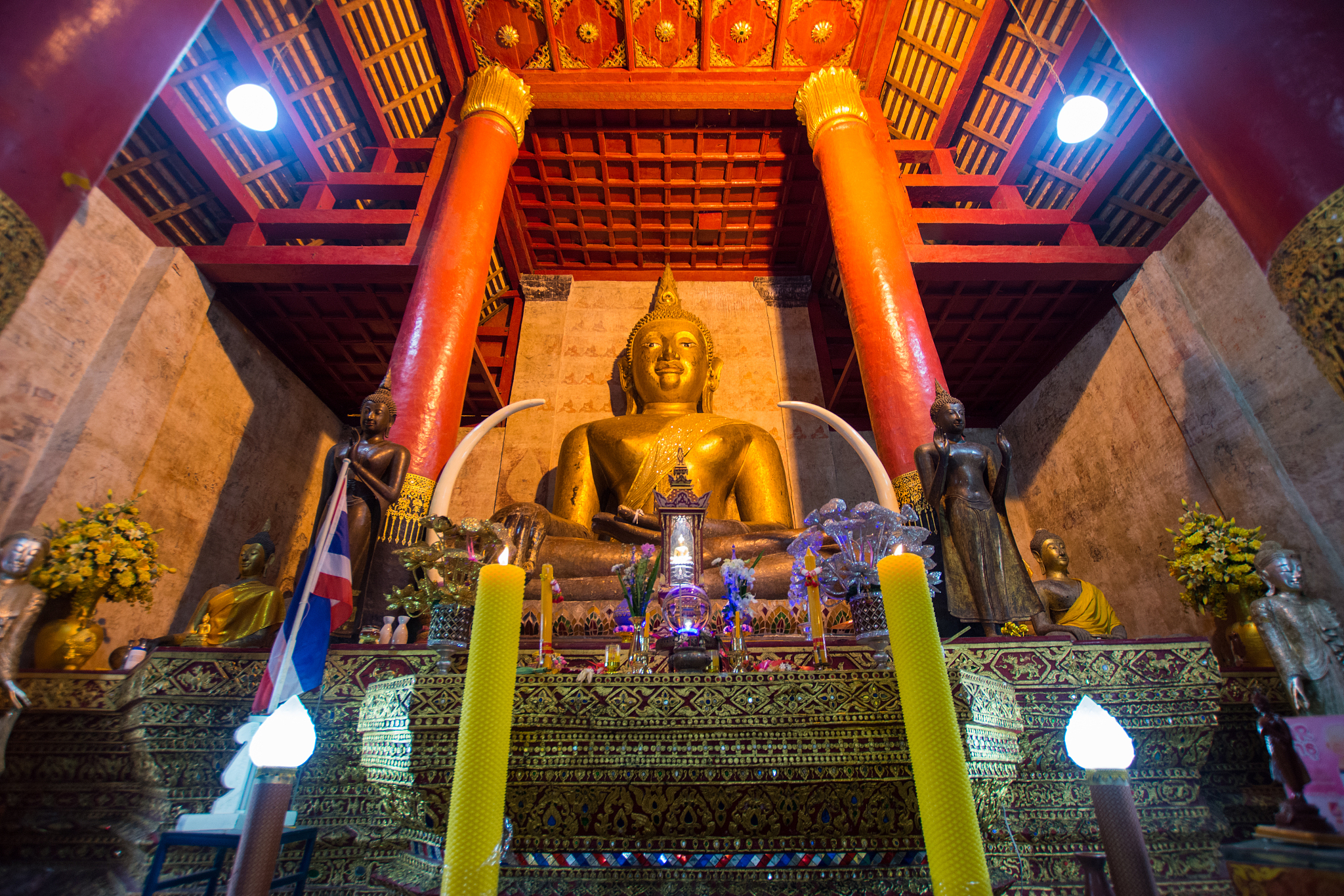 low angle view of buddha statue in illuminated temple