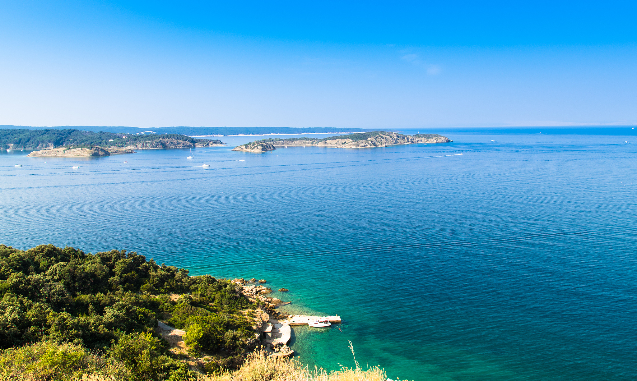 the crystal clear sea surrounding the island of rab, croatia.