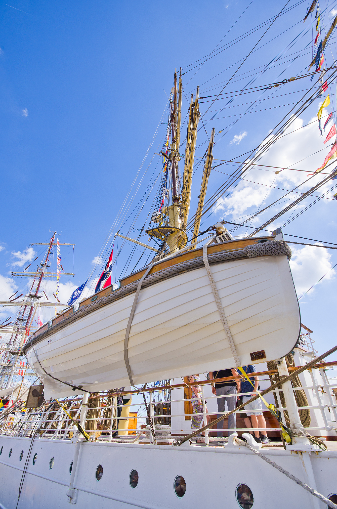 white lifeboat on the ship