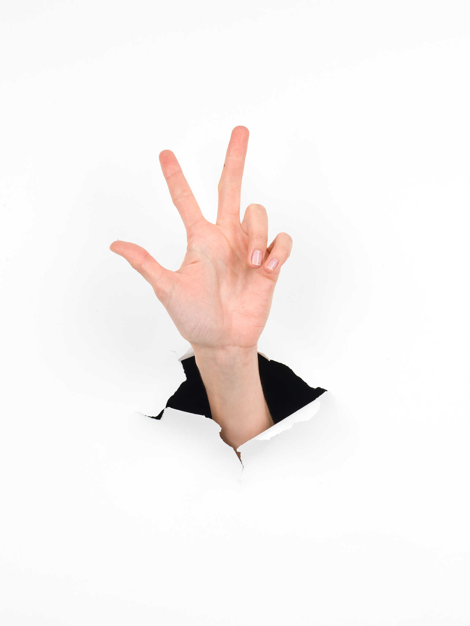 hand counting number three gesture, paper with hole