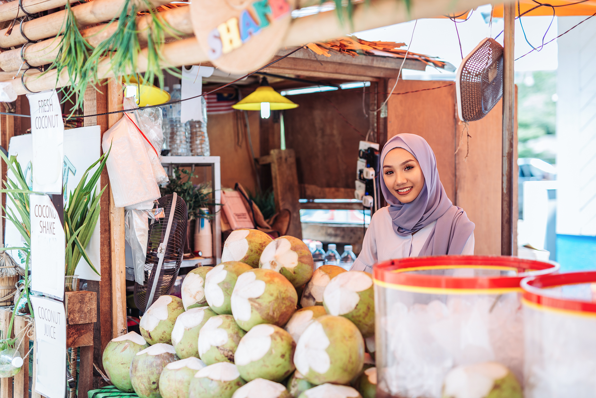 muslim woman buying food at the food market