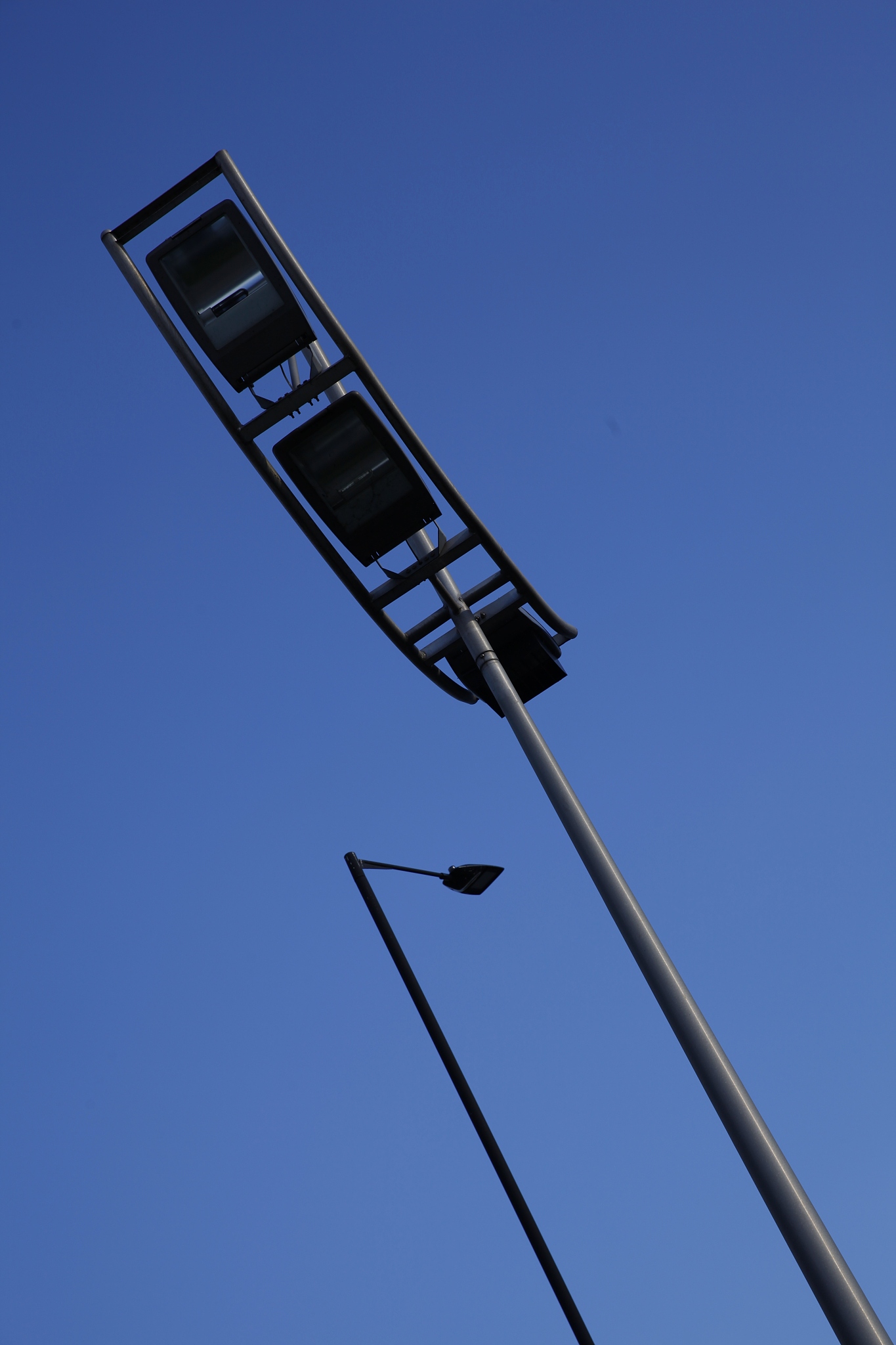 looking up at a modern street lamp.