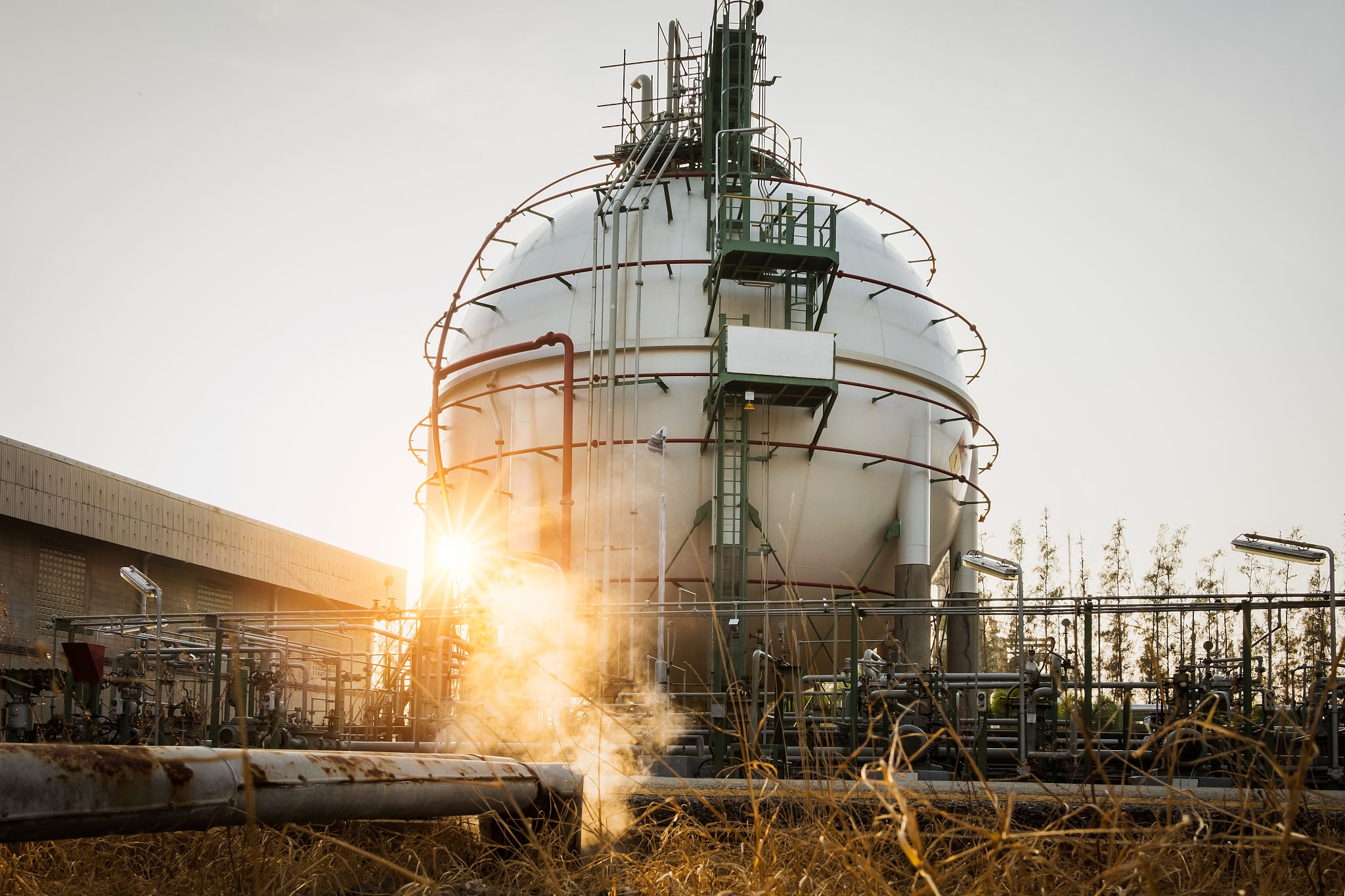 gas storage sphere tanks and steam trap line in morning petroche