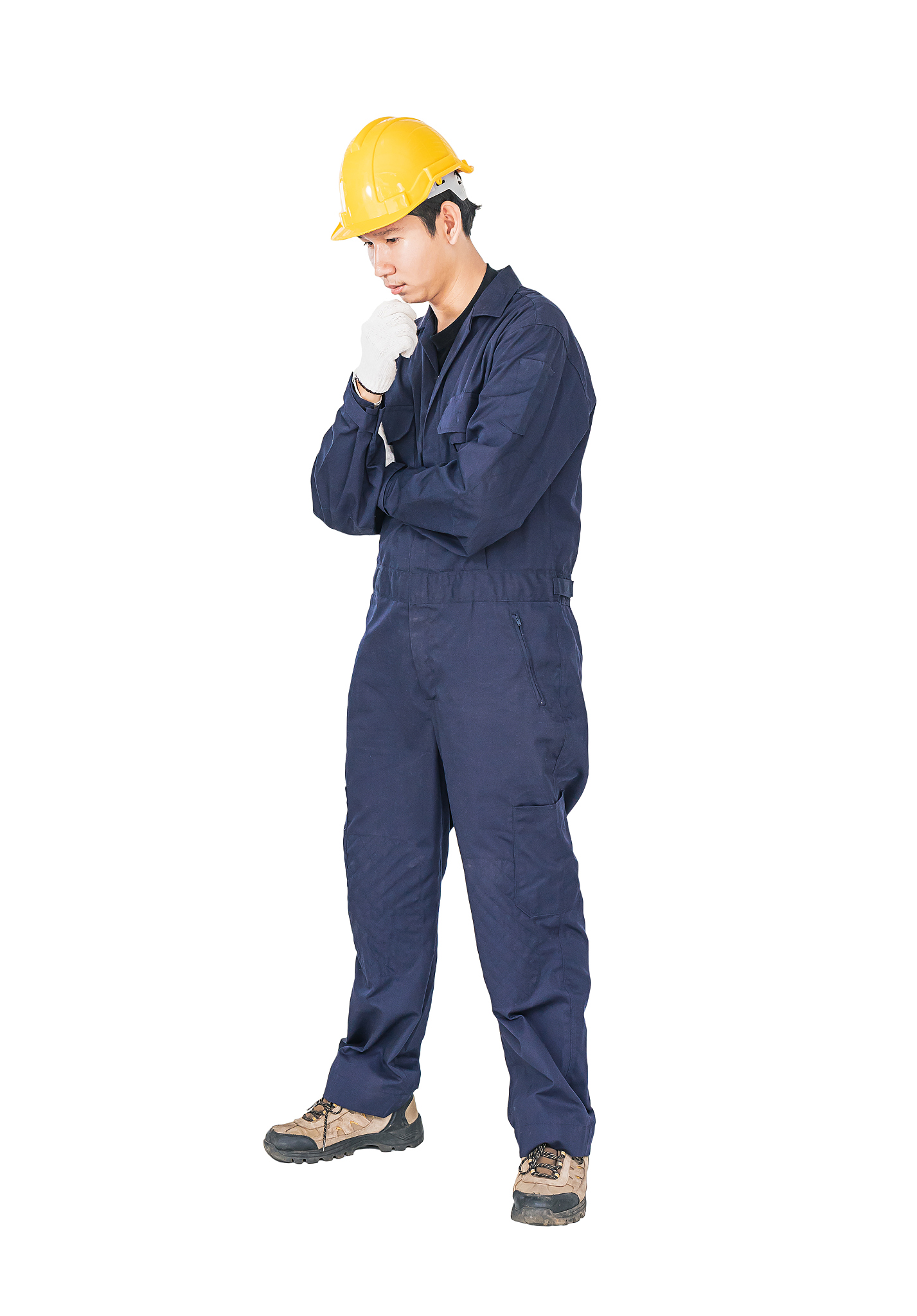 workman with blue coveralls and hardhat in a uniform with clippi