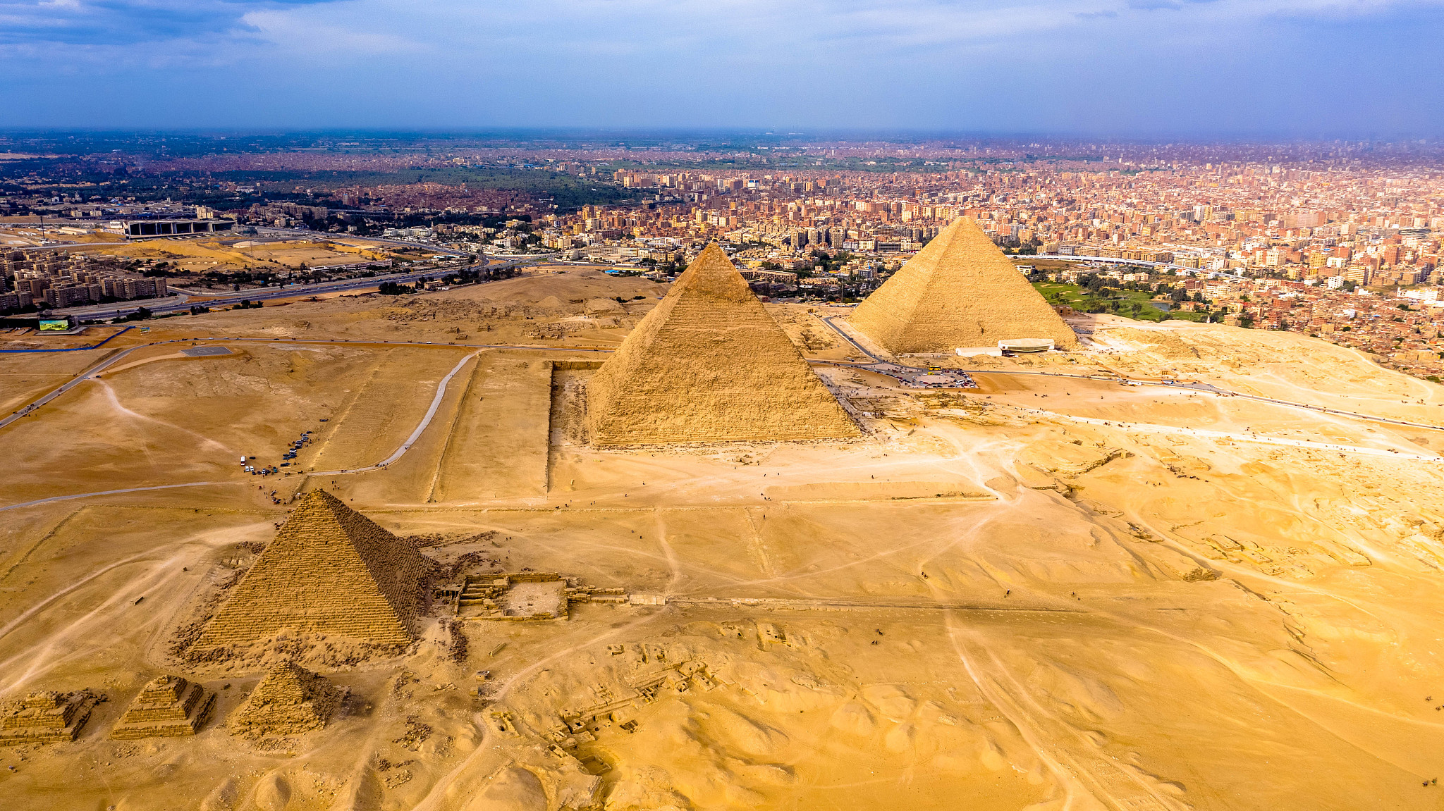 aerial landscape view of giza pyramids in egypt shot by drone.