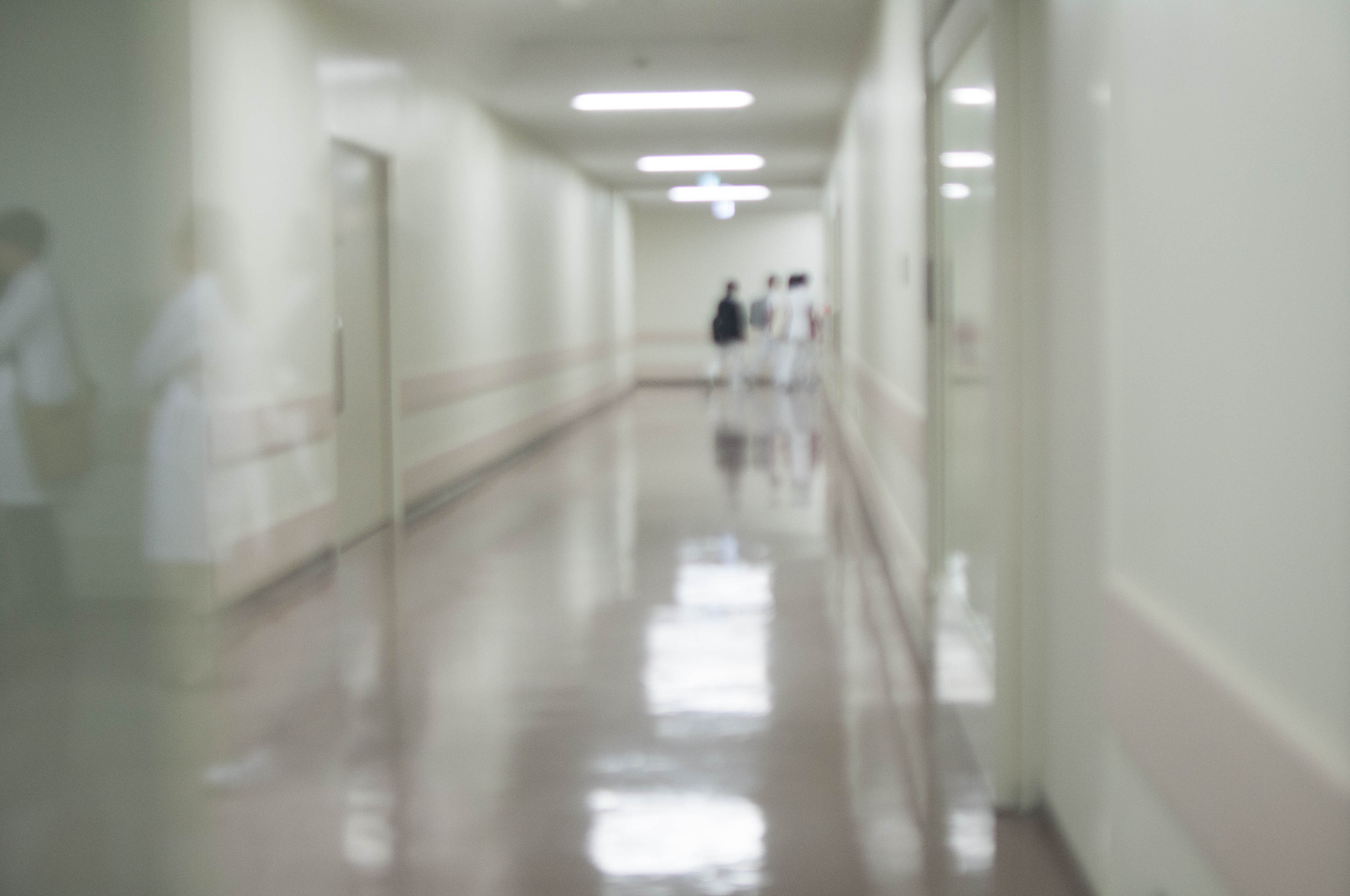 doctors are walking in the hospital hallway