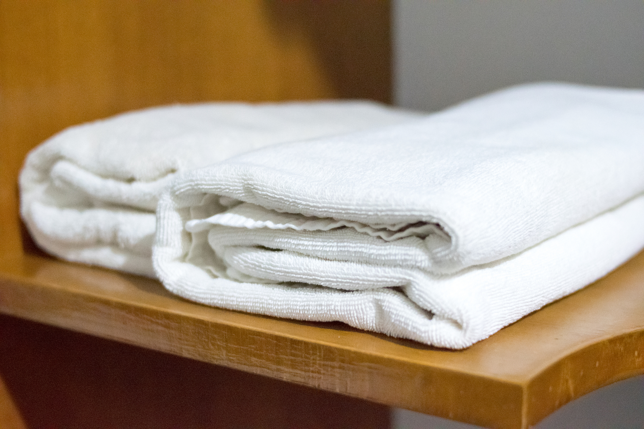 white towel on wooden table