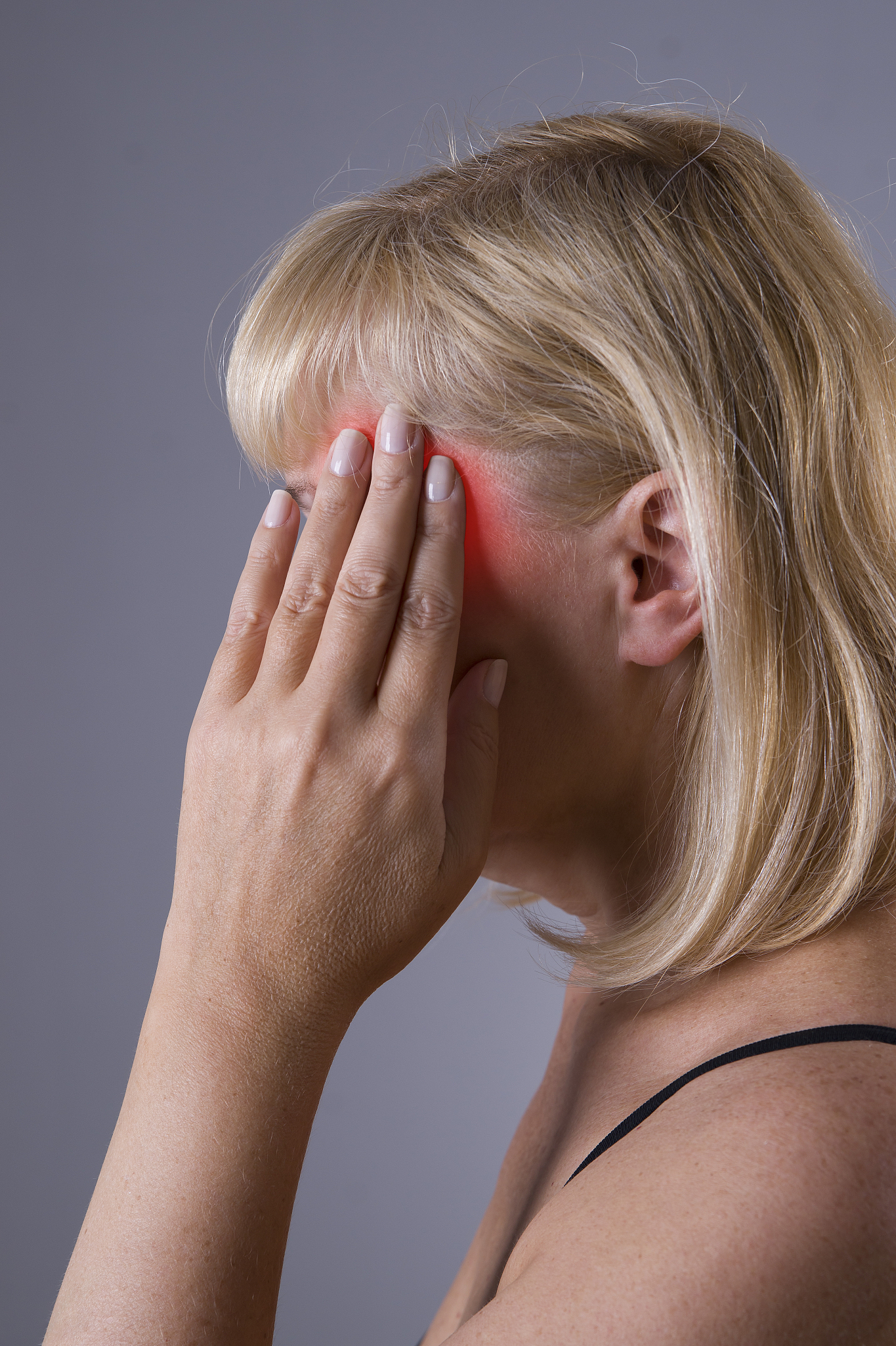 aged blonde woman with headache, migraine and depression
