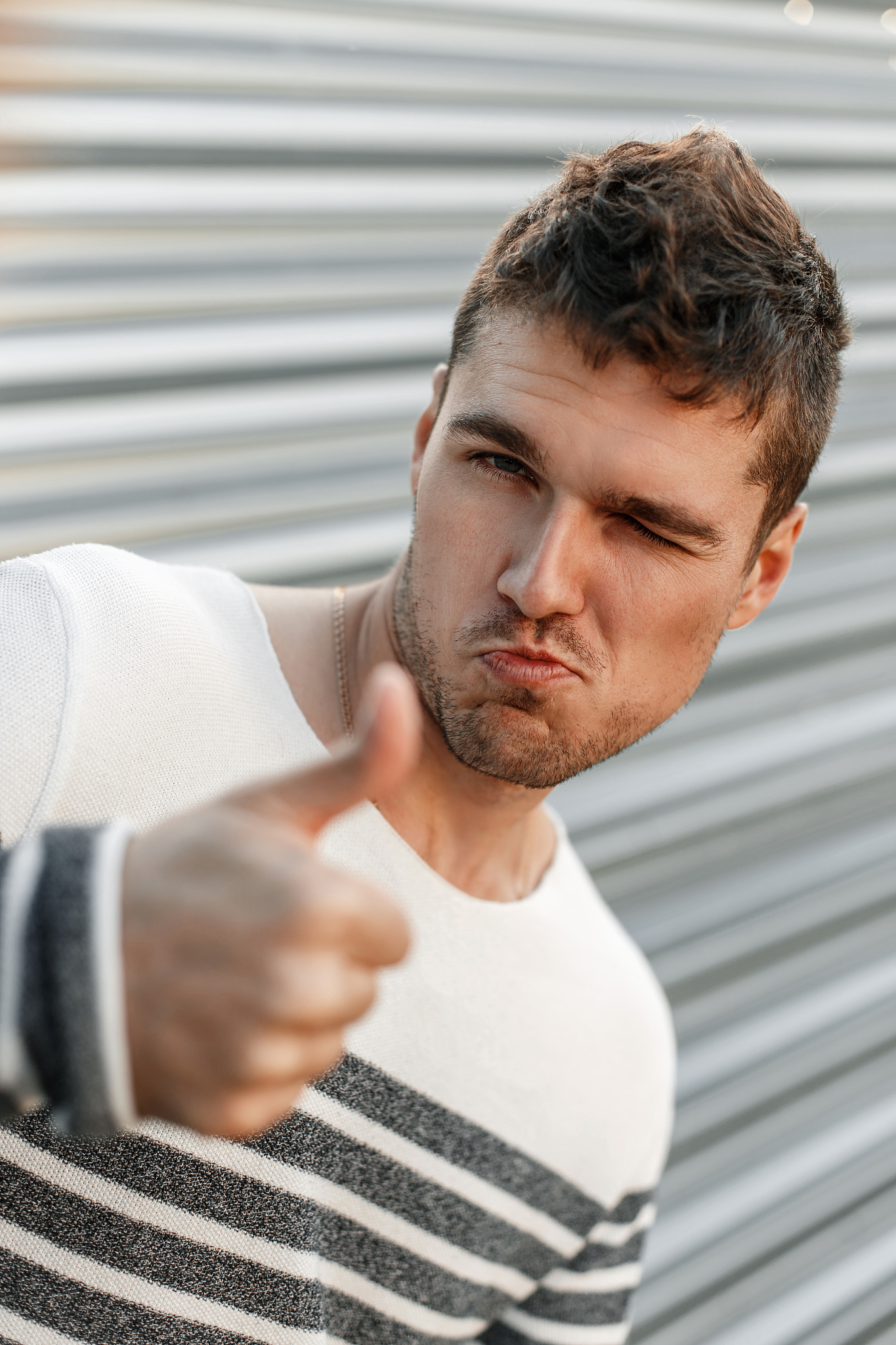 handsome man showing thumbs up, approve.