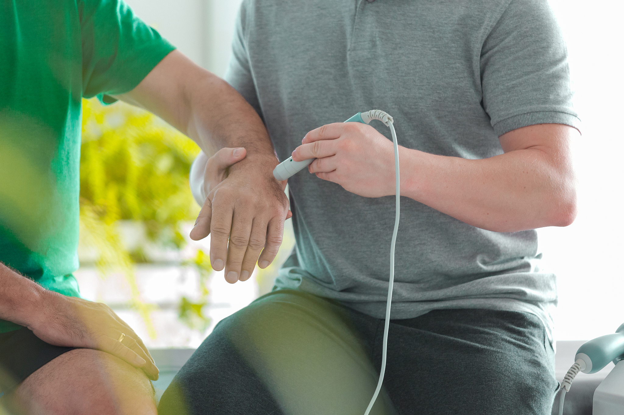 man during laser physiotherapy