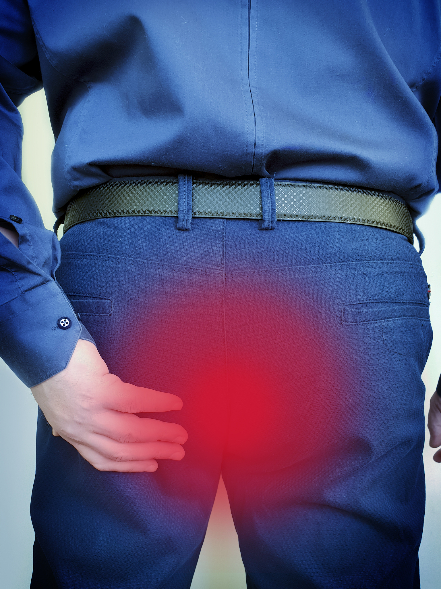 man suffers from hemorrhoids