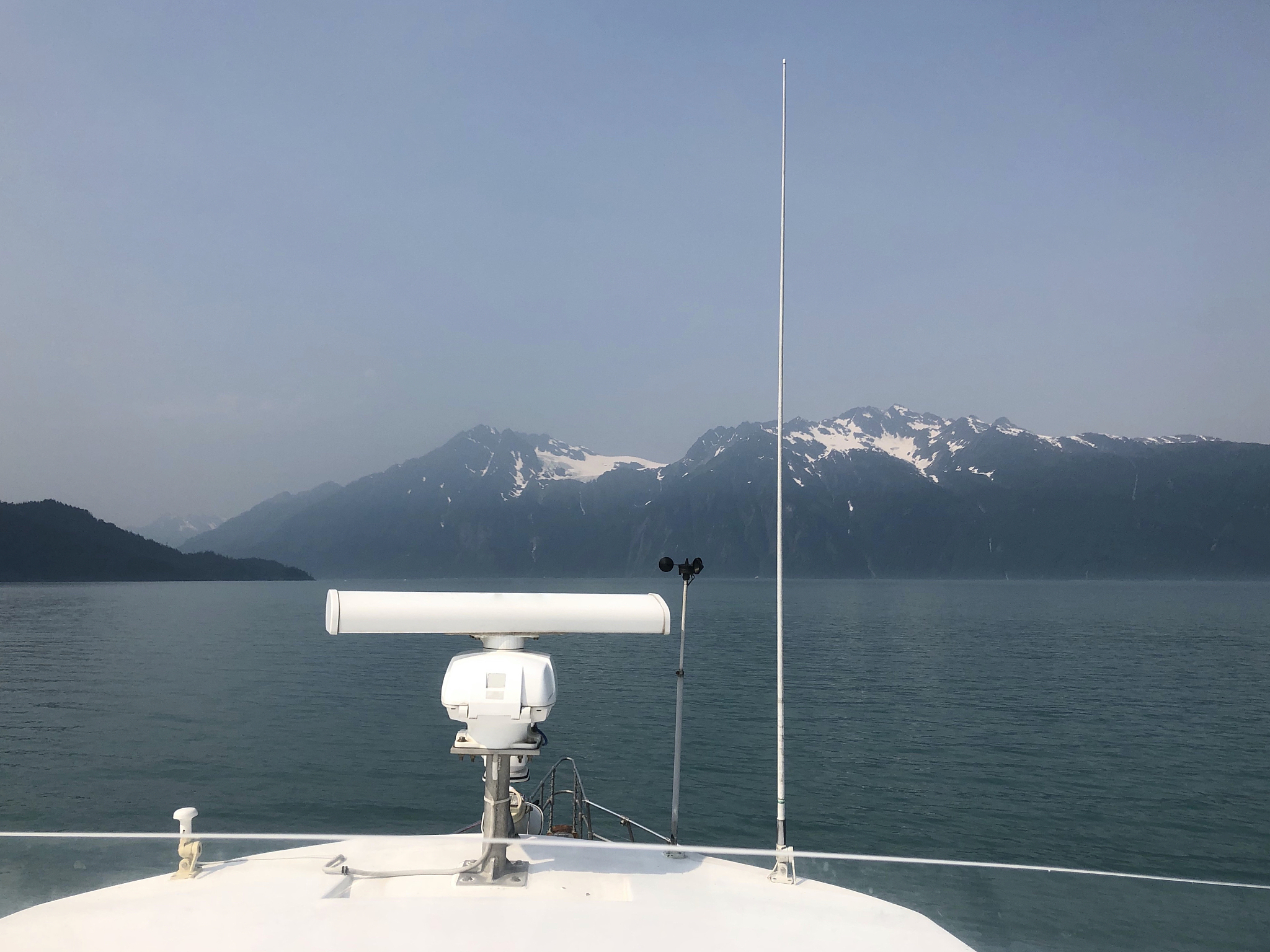 tour boat and snowcapped mountain in alaska