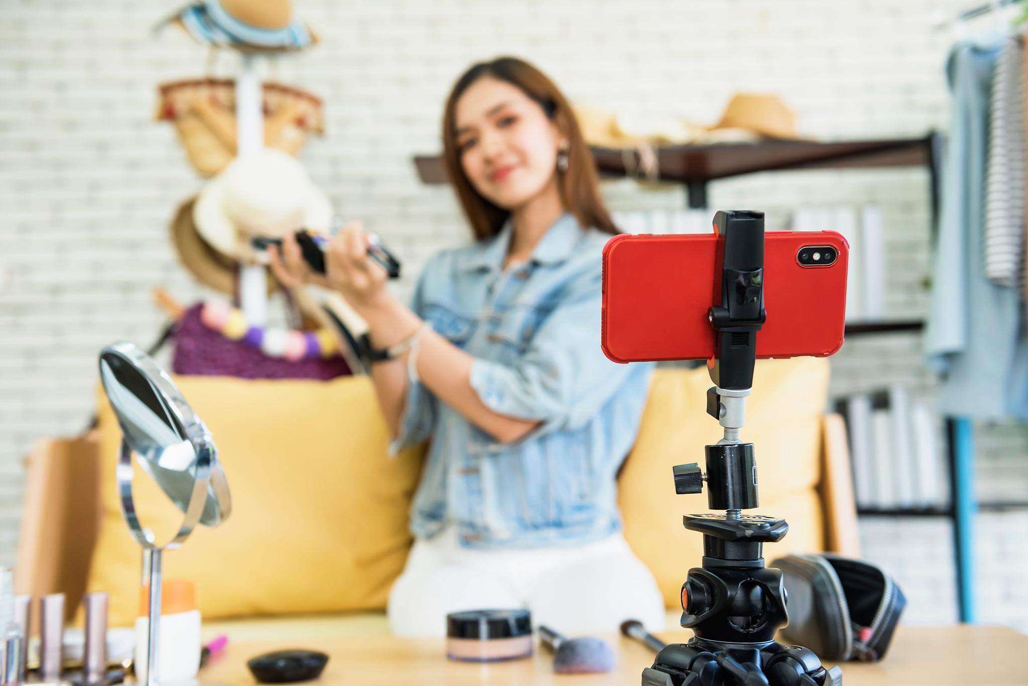 beauty blogger show daily make up. focus at phone
